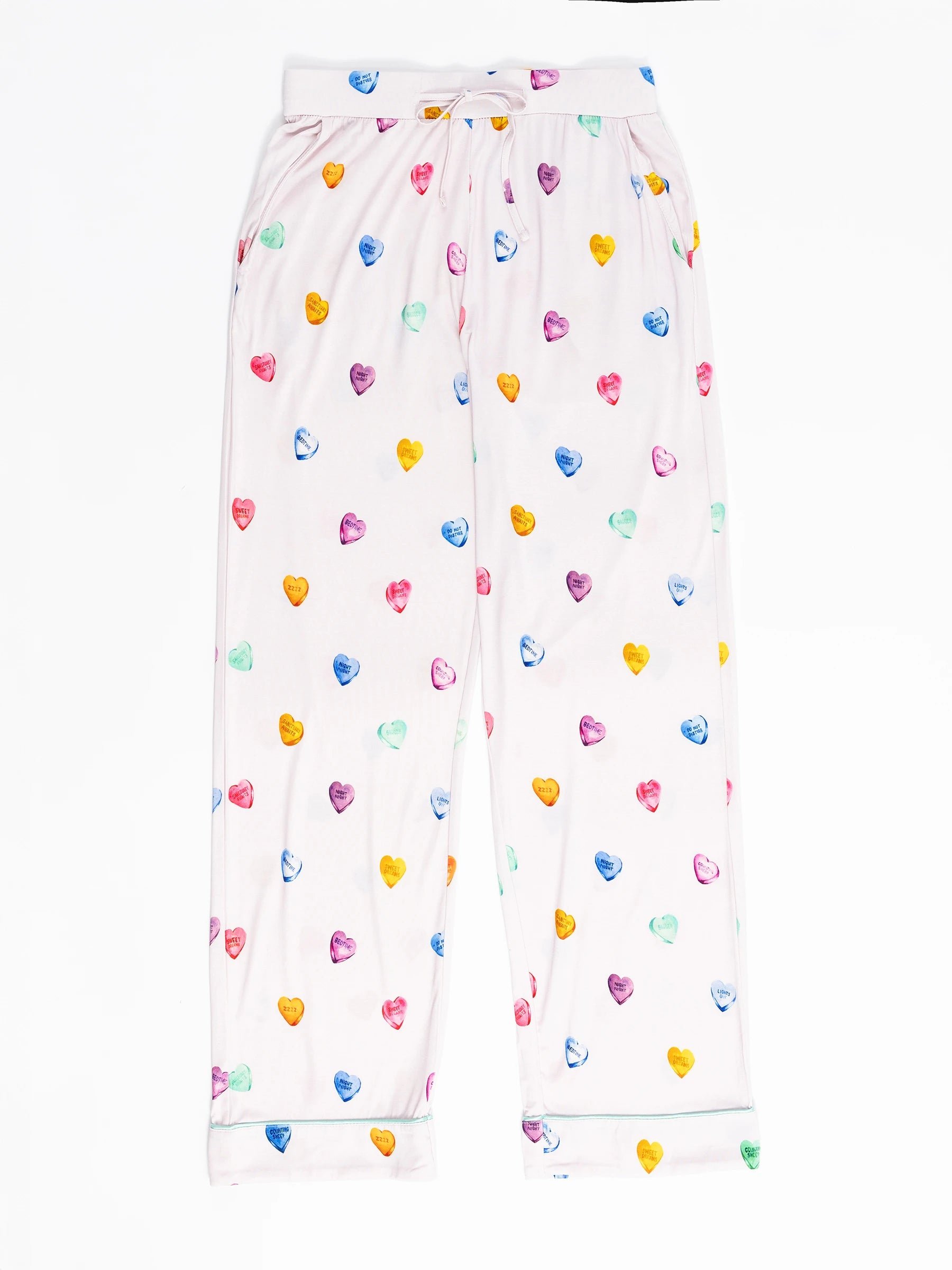 The Women's Stretch-Knit Bamboo Pajama Pant by Cozy Earth features a pastel palette with multicolored hearts on a lilac background and has a drawstring waist. 