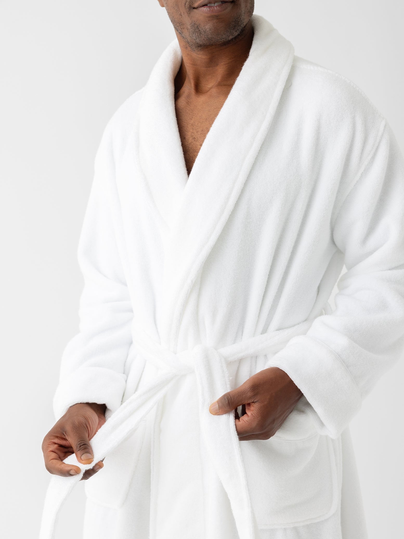 Close up of white bath robe on man 