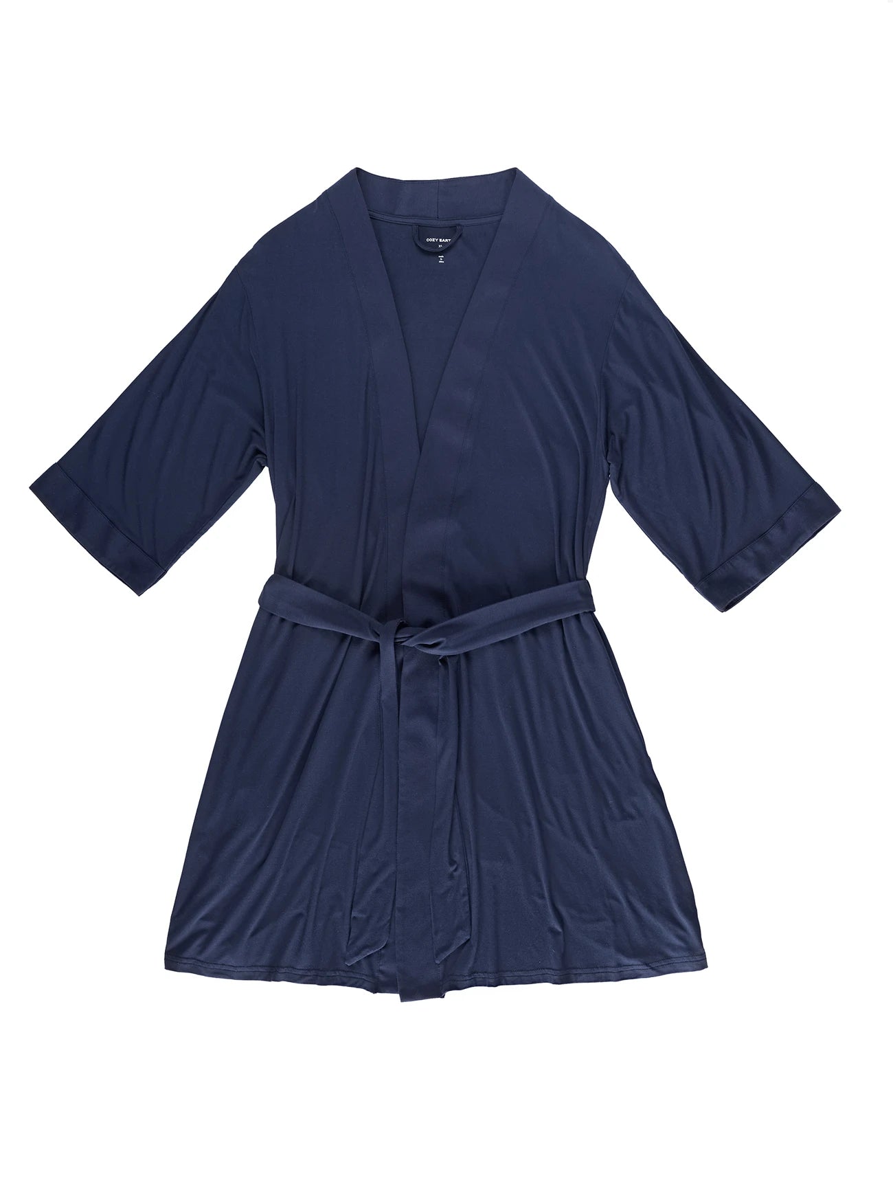 A navy blue Women's Stretch-Knit Bamboo Kimono Robe by Cozy Earth is displayed flat against a white background, showcasing its smooth, elegant fabric. The robe features three-quarter sleeves and comes with a matching belt. 