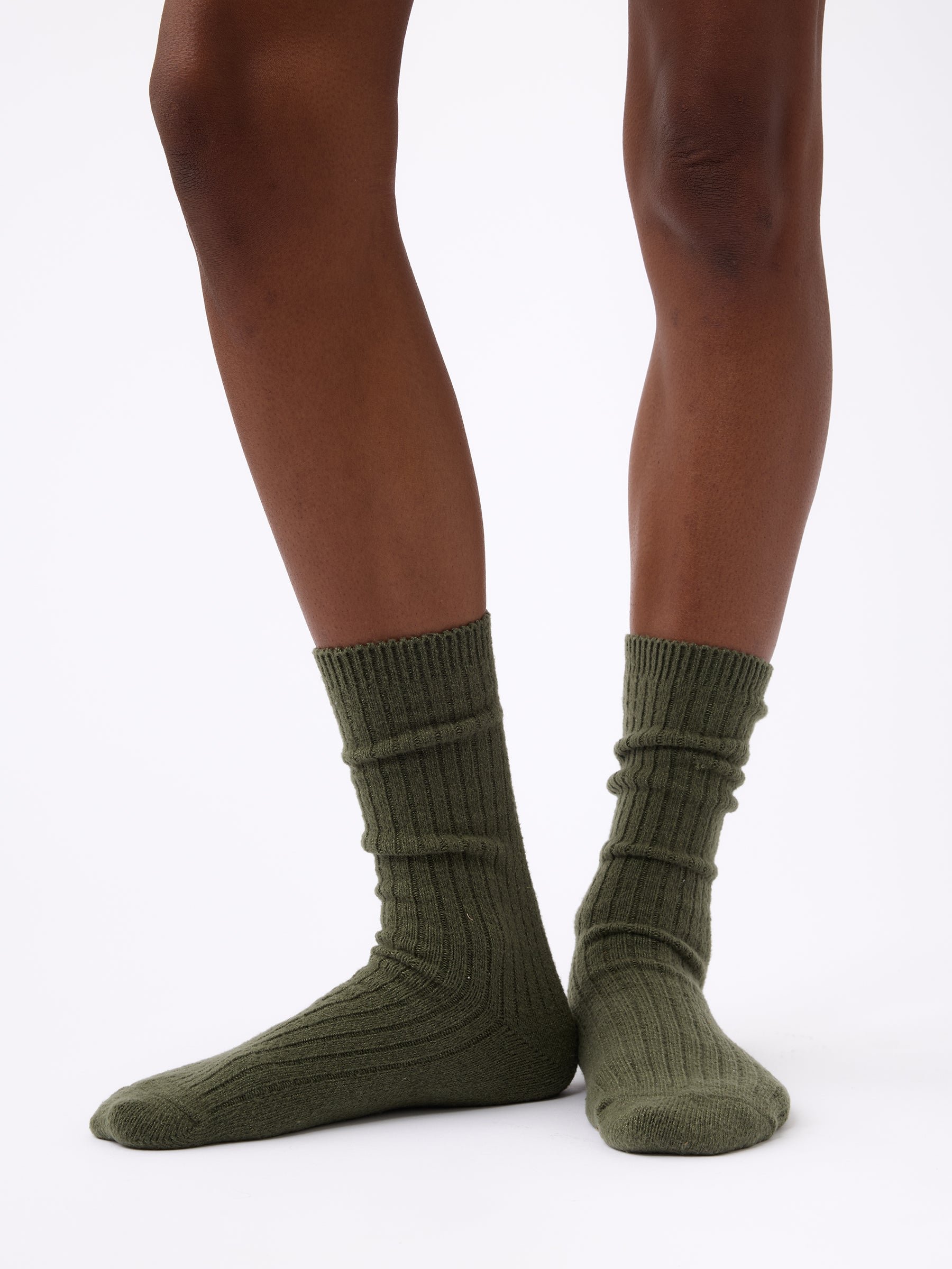 Person wearing Cozy Earth Plush Lounge Sock in Olive 