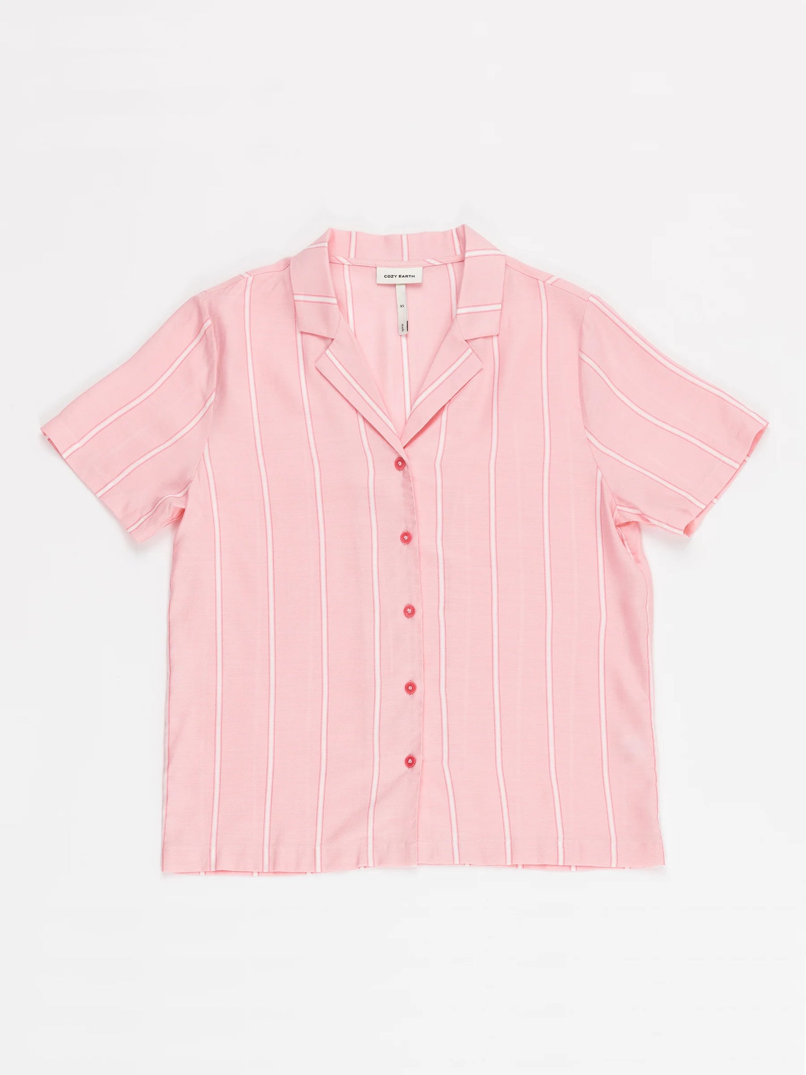 A pink-and-white vertical striped short-sleeve button-up shirt with a notched collar and red buttons from Cozy Earth's Women's Soft Woven Short Sleeve Pajama Set is laid out on a white background. 