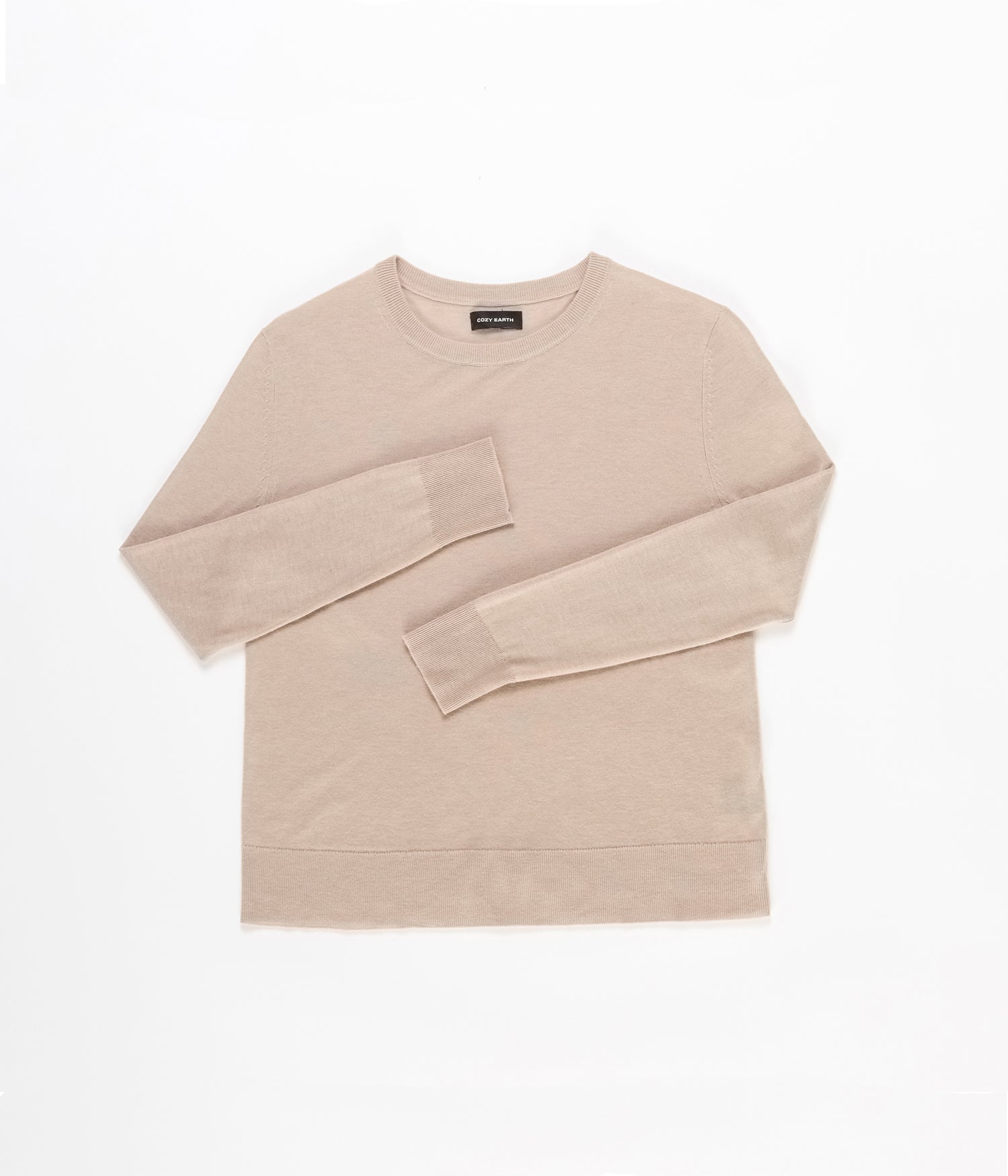 A Women's AirKnit Crewneck Sweater by Cozy Earth, in beige, is laid flat on a white background, featuring soft fabric with visible stitching at the cuffs and hem. 