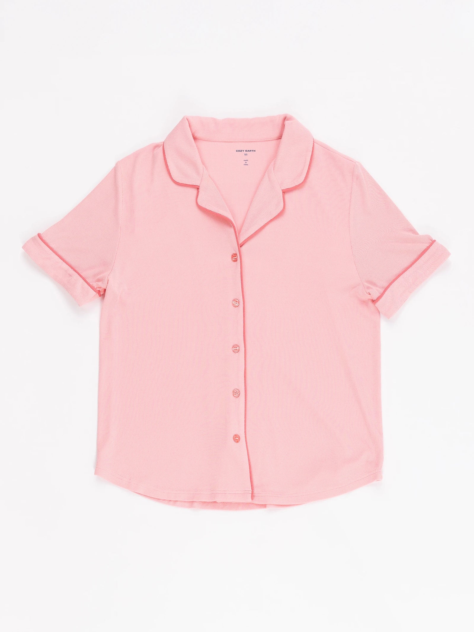 A pink short-sleeve shirt with a collar, part of the Women's Rib-Knit Classic Pajama Set by Cozy Earth, displayed on a white background. 