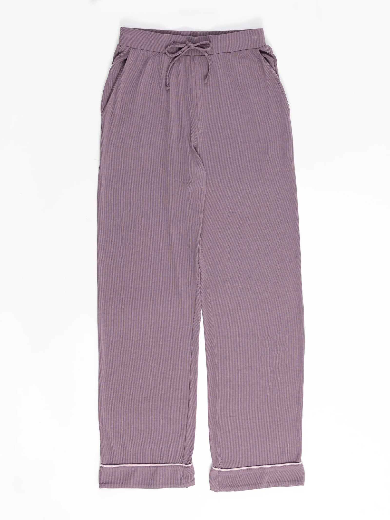 A pair of Cozy Earth's Rib-Knit Classic Long Sleeve Pajama Set pants in Twilight, featuring an elastic waistband, drawstring, front pockets, and folded cuffs, is laid flat against a white background. 