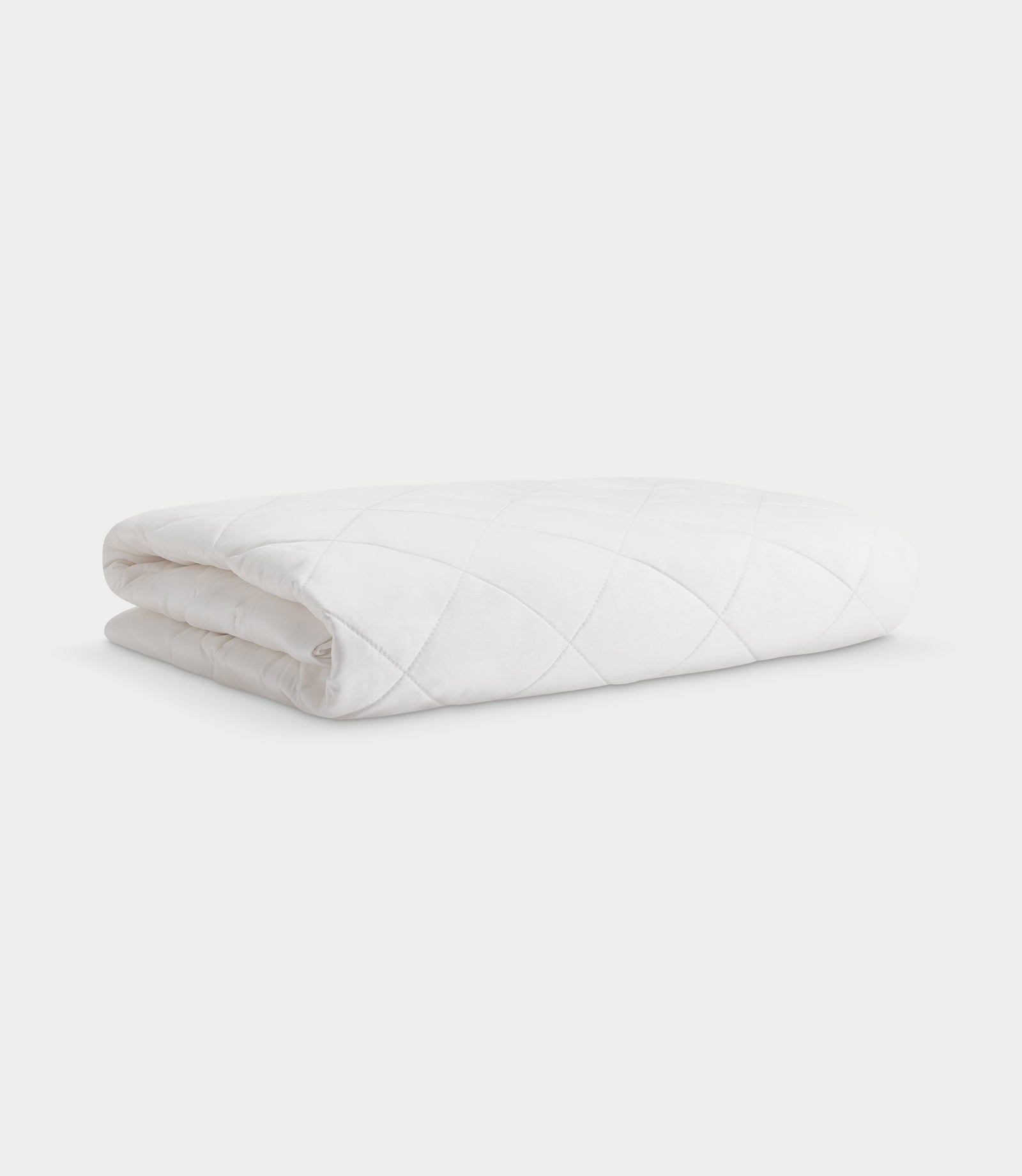 Mattress pad folded with white background