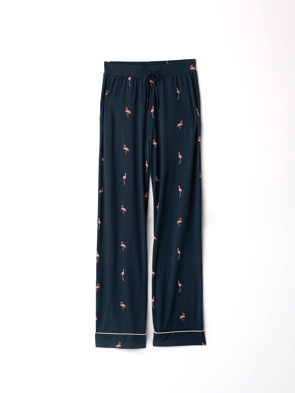 Flat lay of flamingo print pajama pants with white background 