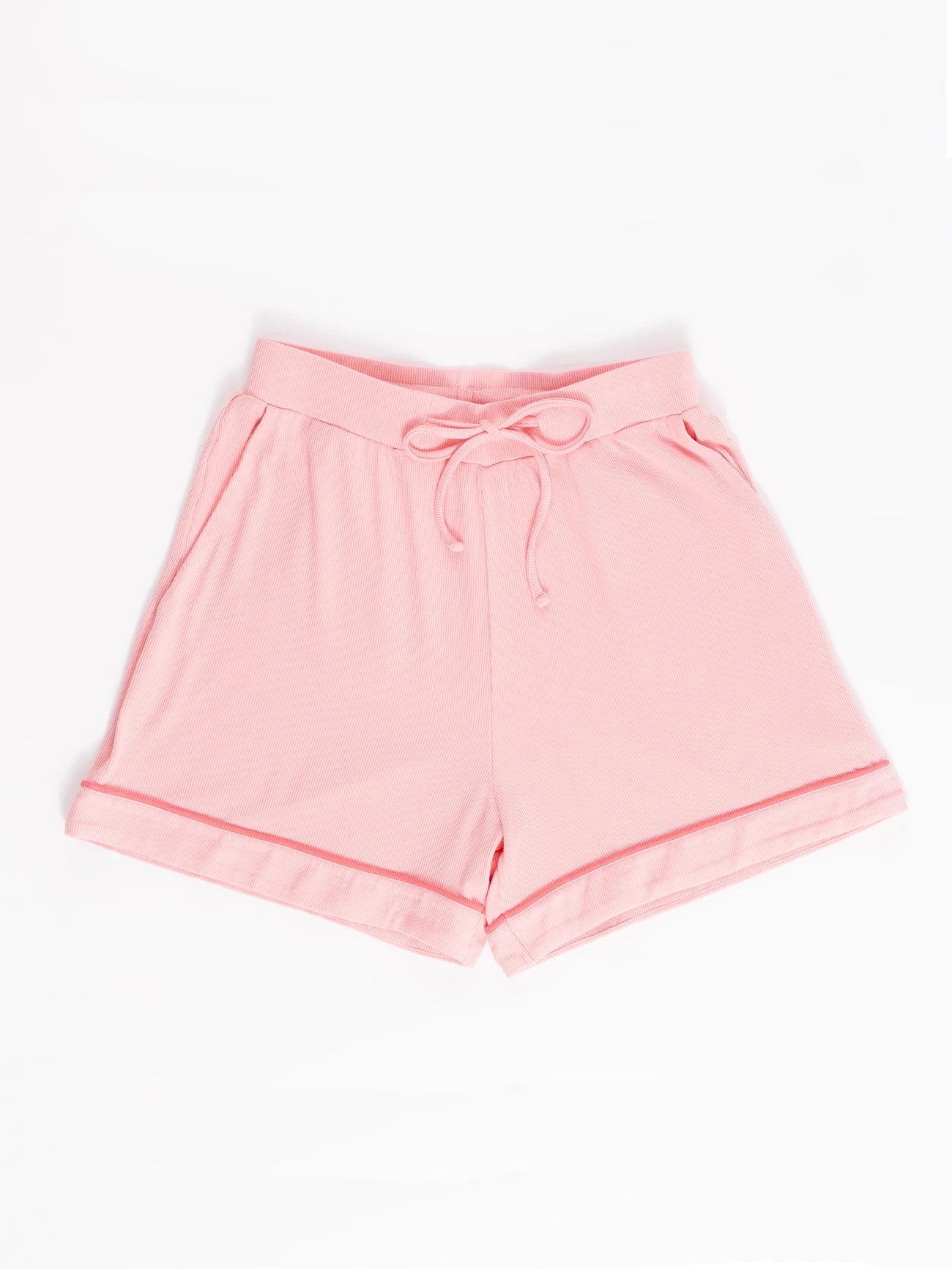 A pair of light pink shorts with a drawstring waist, rolled-up hems, side pockets, and a relaxed fit is displayed on a white background. Suitable for casual wear, these shorts are part of the Women's Rib-Knit Classic Short Sleeve Pajama Set by Cozy Earth. 