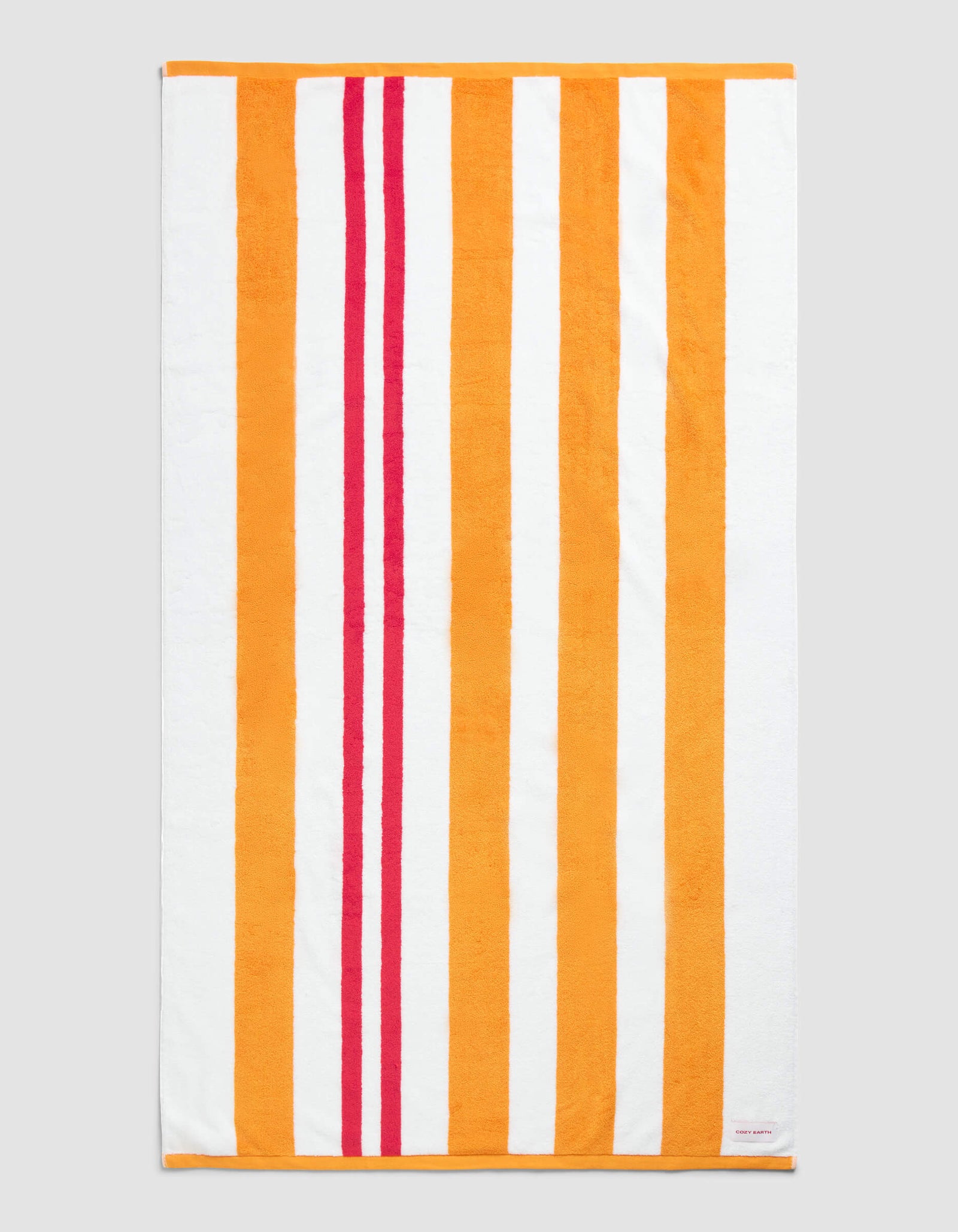The Cozy Earth Classic Stripe Resort Towel in Picante Stripe features a rectangular design with vertical orange, red, and white stripes—wide orange and white bands paired with two narrower red stripes near the left edge.