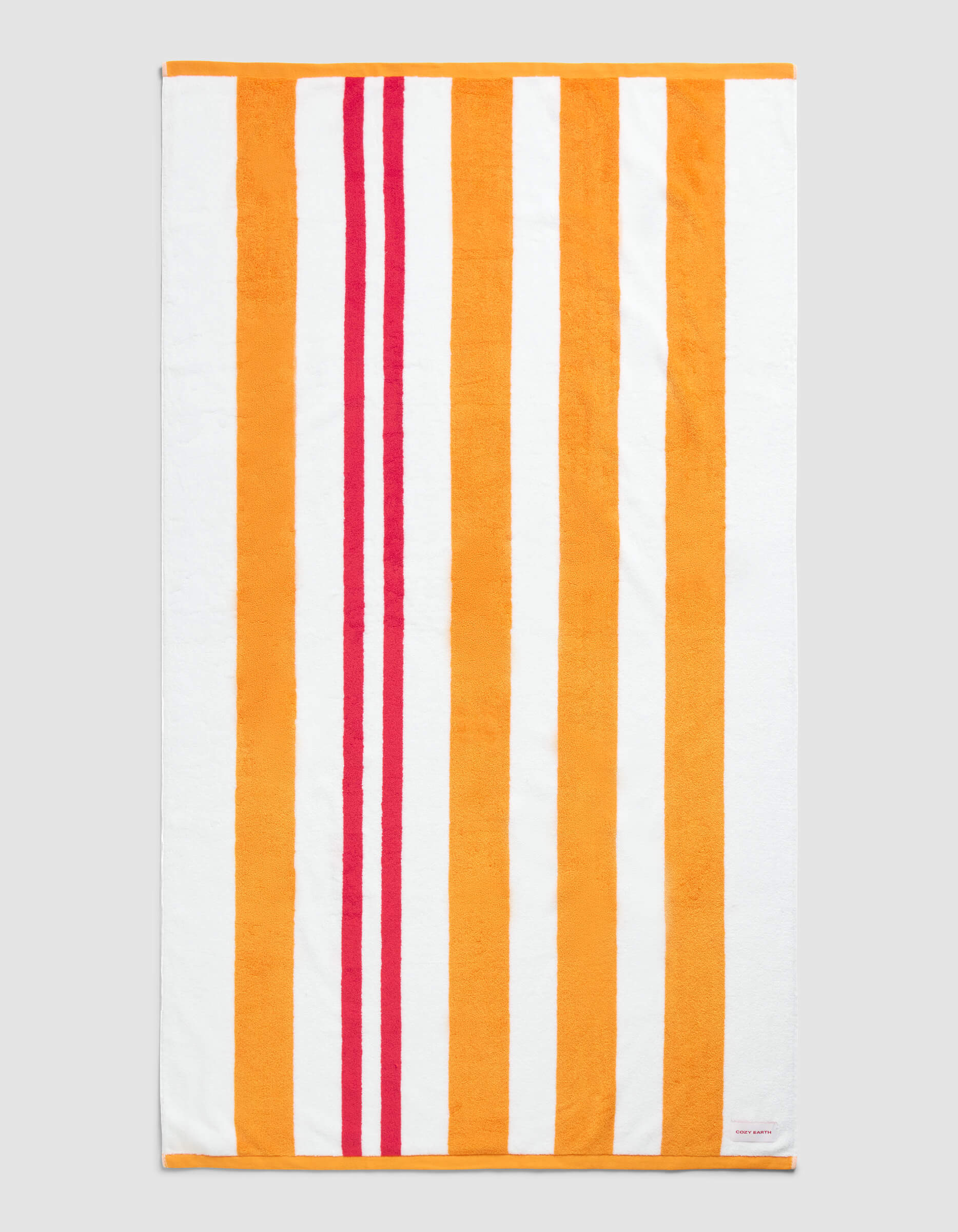 The Cozy Earth Classic Stripe Resort Towel in Picante Stripe features a rectangular design with vertical orange, red, and white stripes—wide orange and white bands paired with two narrower red stripes near the left edge.|Color:Picante Stripe