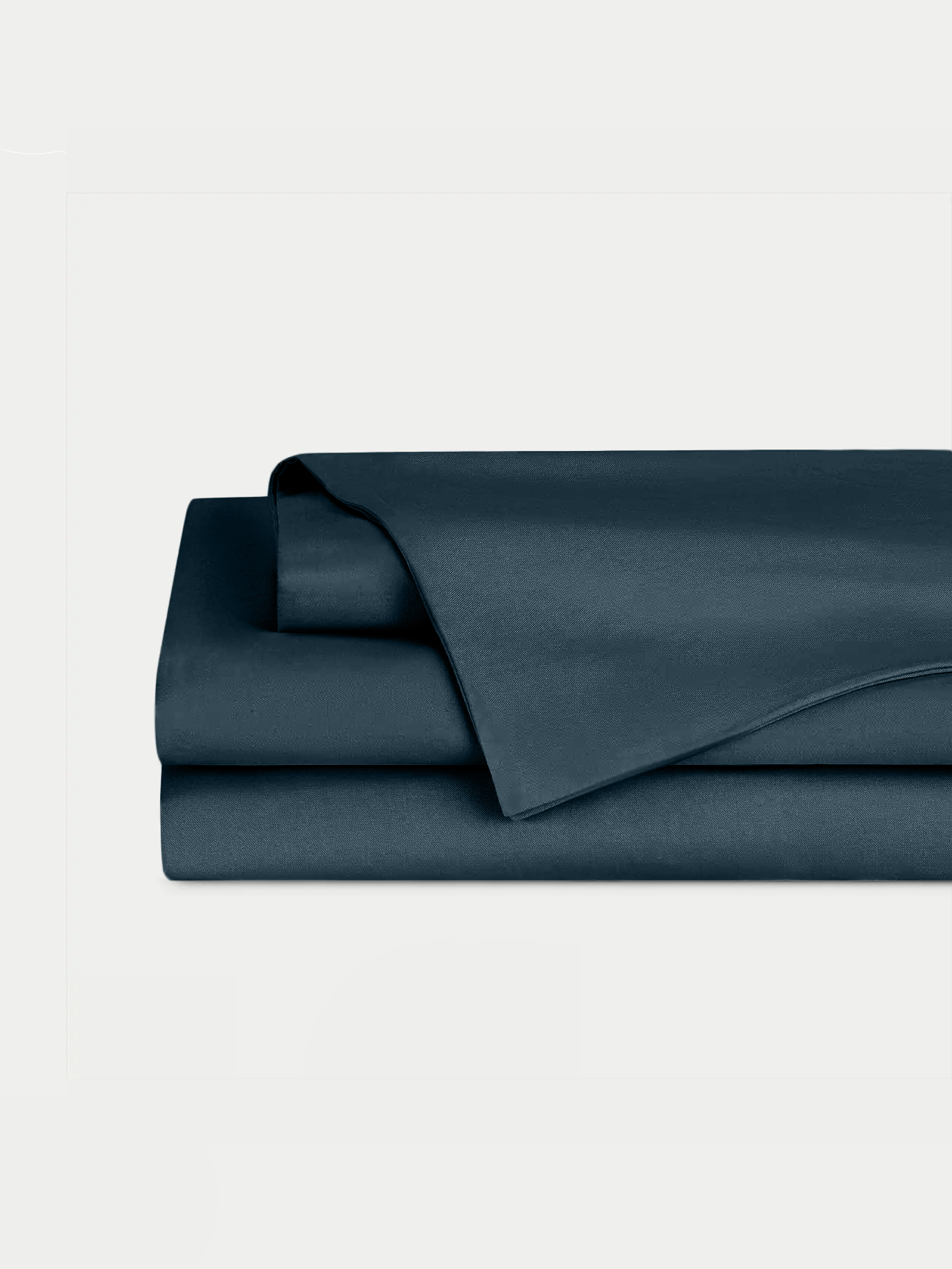 Navy Bamboo Linen Sheet Set neatly folded over a white background. 