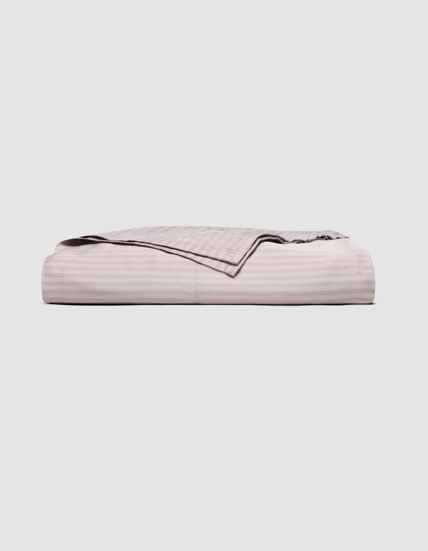 Folded light pink Cozy Earth Bamboo Flat Sheet with white horizontal stripes.