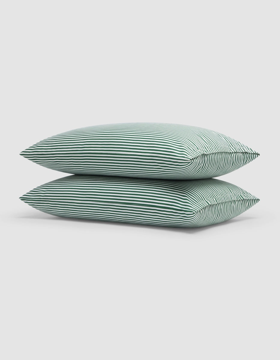Two Cozy Earth Bamboo Pillowcases stacked on top of each other, featuring a green and white horizontal stripe pattern.