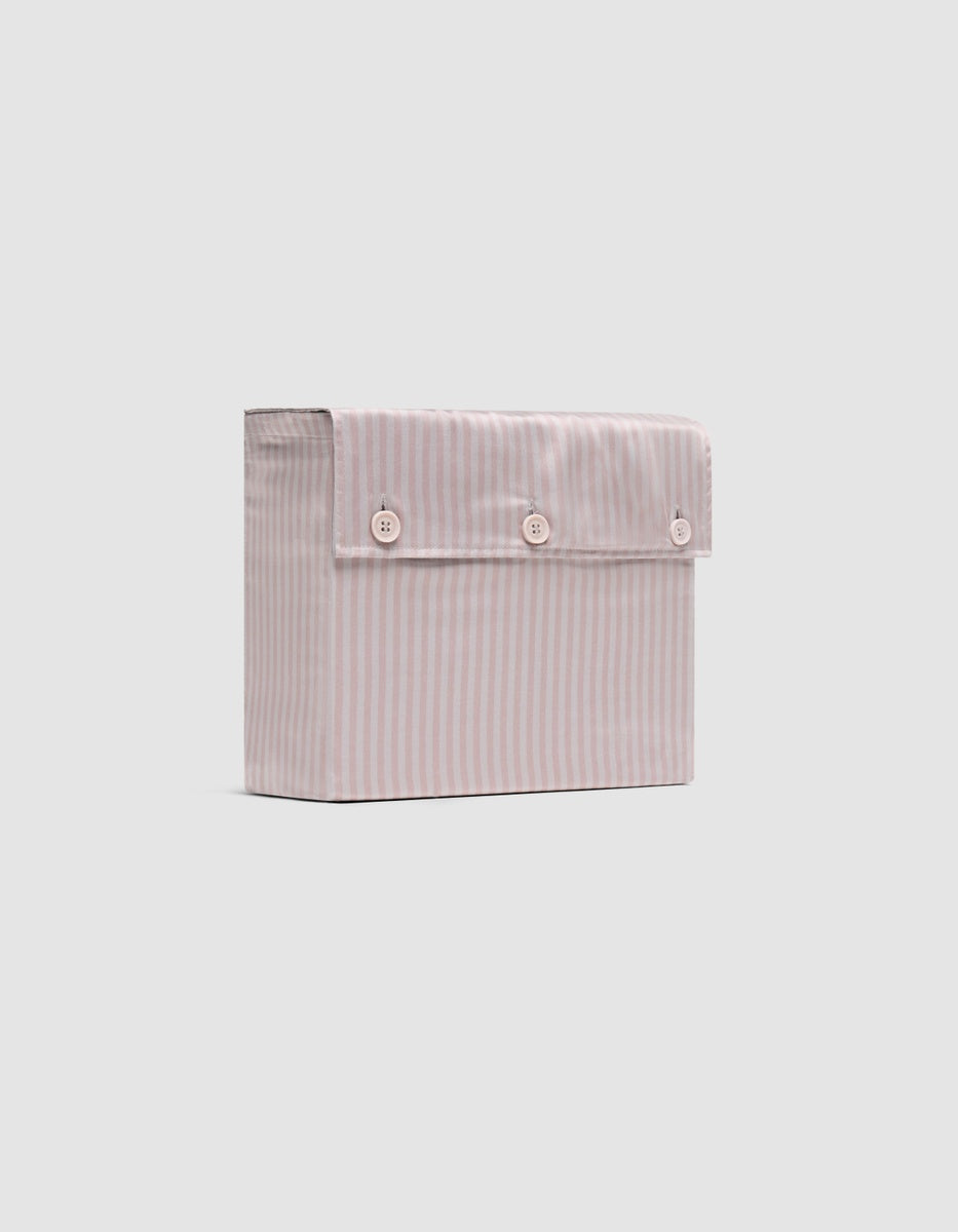 A Cozy Earth Bamboo Sheet Set folded inside its matching lavender striped packaging with a three-button flap, featuring a subtle floral pattern and displayed on a plain white background.