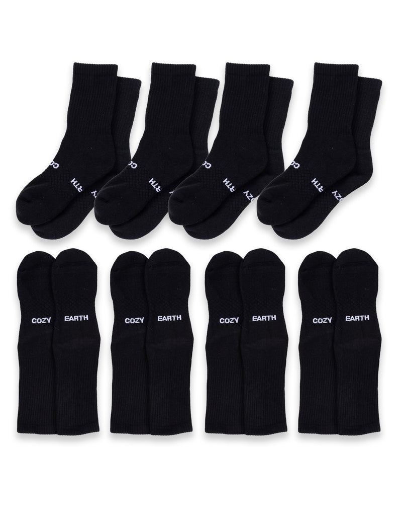 Eight pairs of black Essential Calf Socks by Cozy Earth are shown in two rows; the top row features thin white text on the toes, while the bottom row displays "COZY EARTH" in white across each sock.