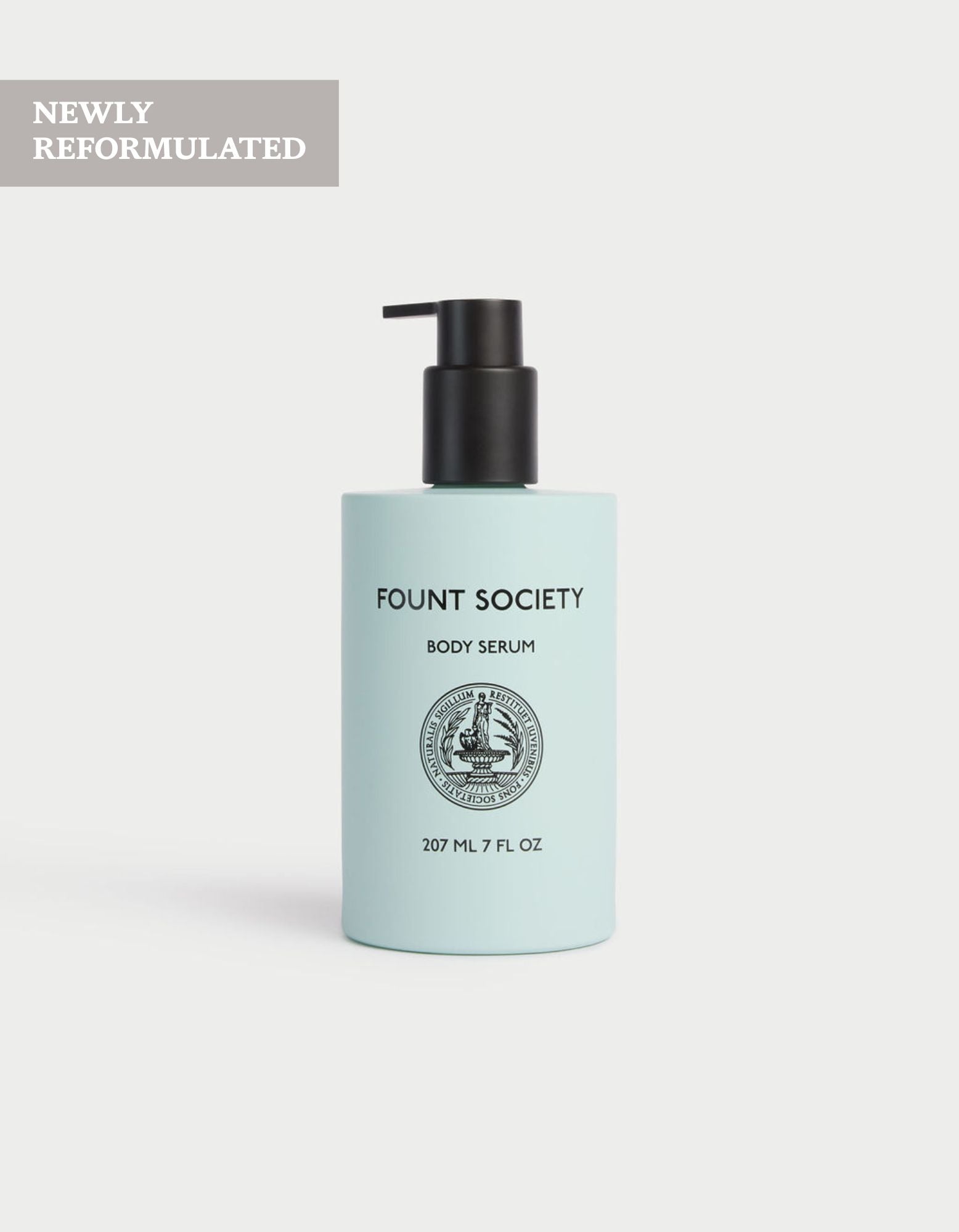 A light blue bottle of Cozy Earth Body Serum, 207 ml (7 fl oz), with a black pump top is displayed against a plain light background. A corner label states "NEWLY REFORMULATED.
