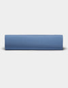 A neatly folded Bamboo Jersey Sheet Set by Cozy Earth is displayed against a plain, light gray background.|Color:Sailor