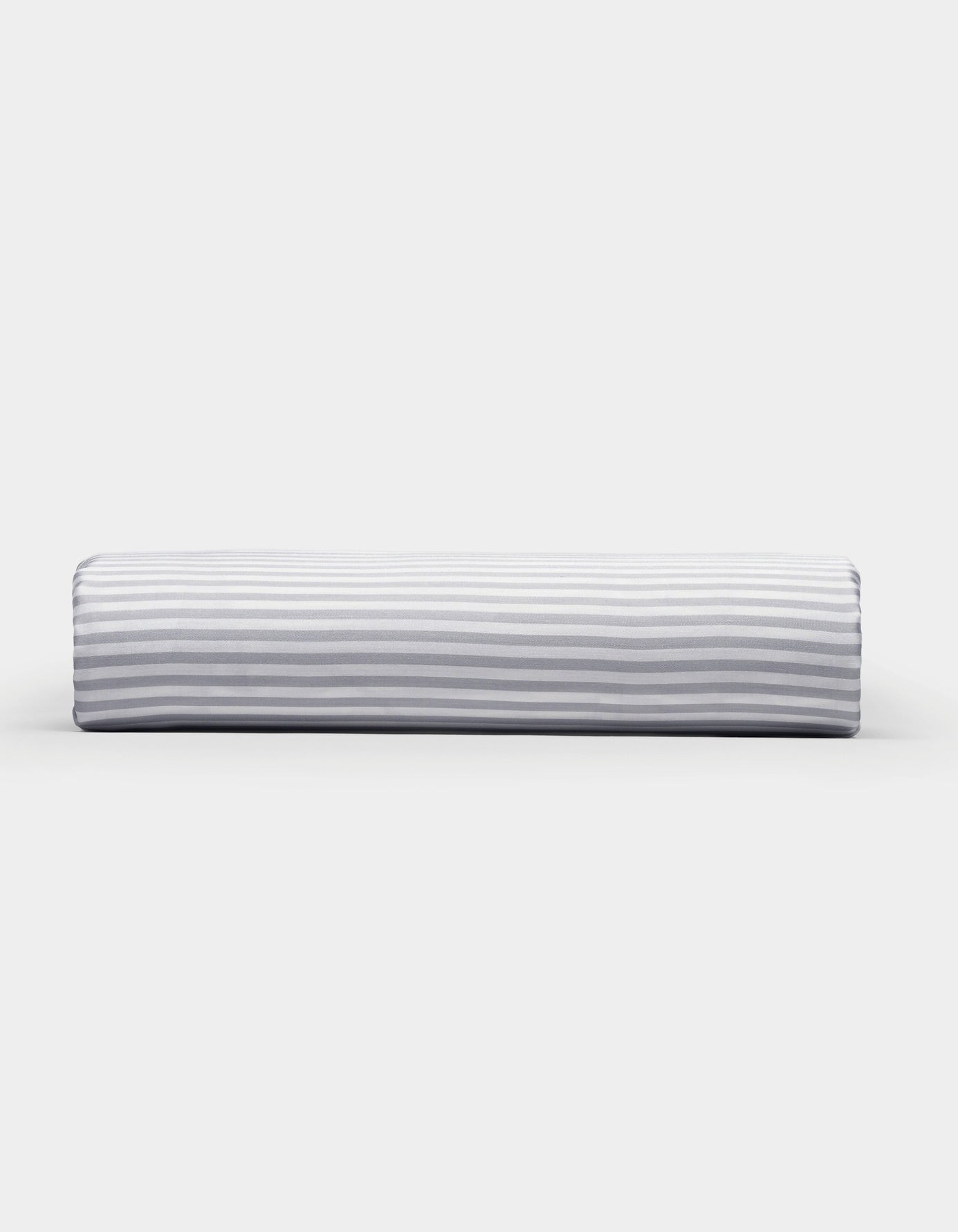 A Bamboo Fitted Sheet by Cozy Earth, featuring a light gray and white horizontal striped pattern, photographed on a plain white background.