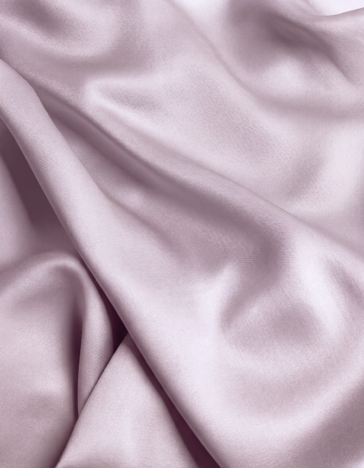 Close-up of the Cozy Earth Bamboo Flat Sheet in a smooth, light lavender shade, featuring gentle folds and a soft sheen that highlights its silky texture.