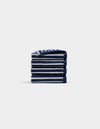 A neatly folded stack of four Cozy Earth Ribbed Terry Washcloths in navy blue and white stripes is centered on a plain, light gray background.|Color:Obsidian Stripe