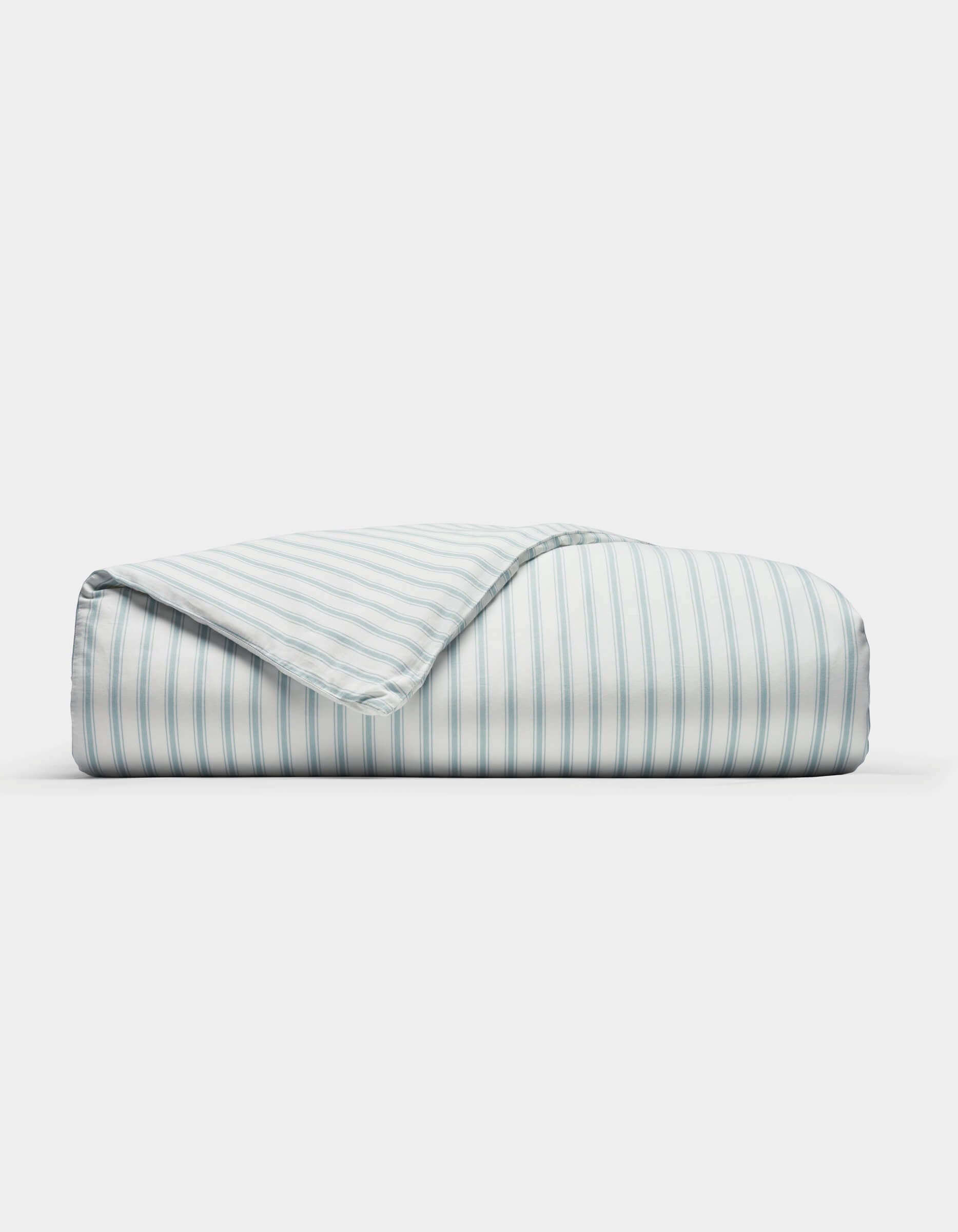 The Cozy Earth Soft-Wash Cotton Duvet Cover features neat light blue and white vertical stripes, displayed folded on a plain white background with one corner turned to show the underside pattern.