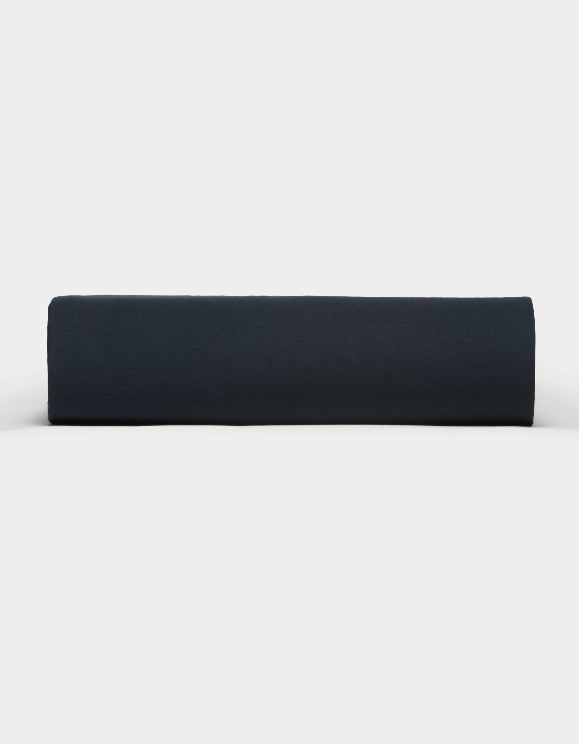 The Cozy Earth Soft-Wash Cotton Fitted Sheet in dark navy blue is neatly rolled and displayed from the side against a plain white background.