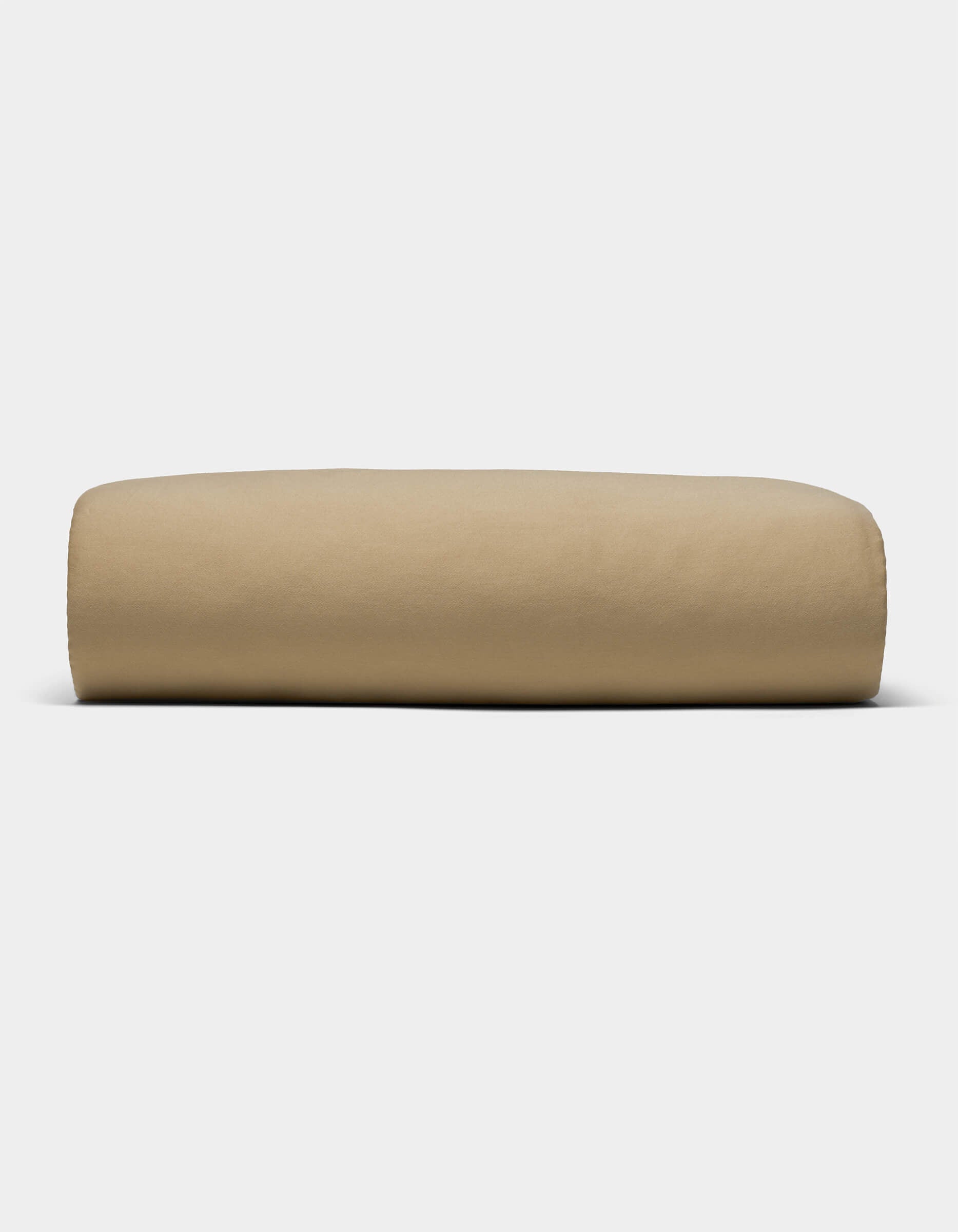 The Cozy Earth Soft-Wash Cotton Sheet Set, in a light brown shade, is shown neatly folded against a plain white background.