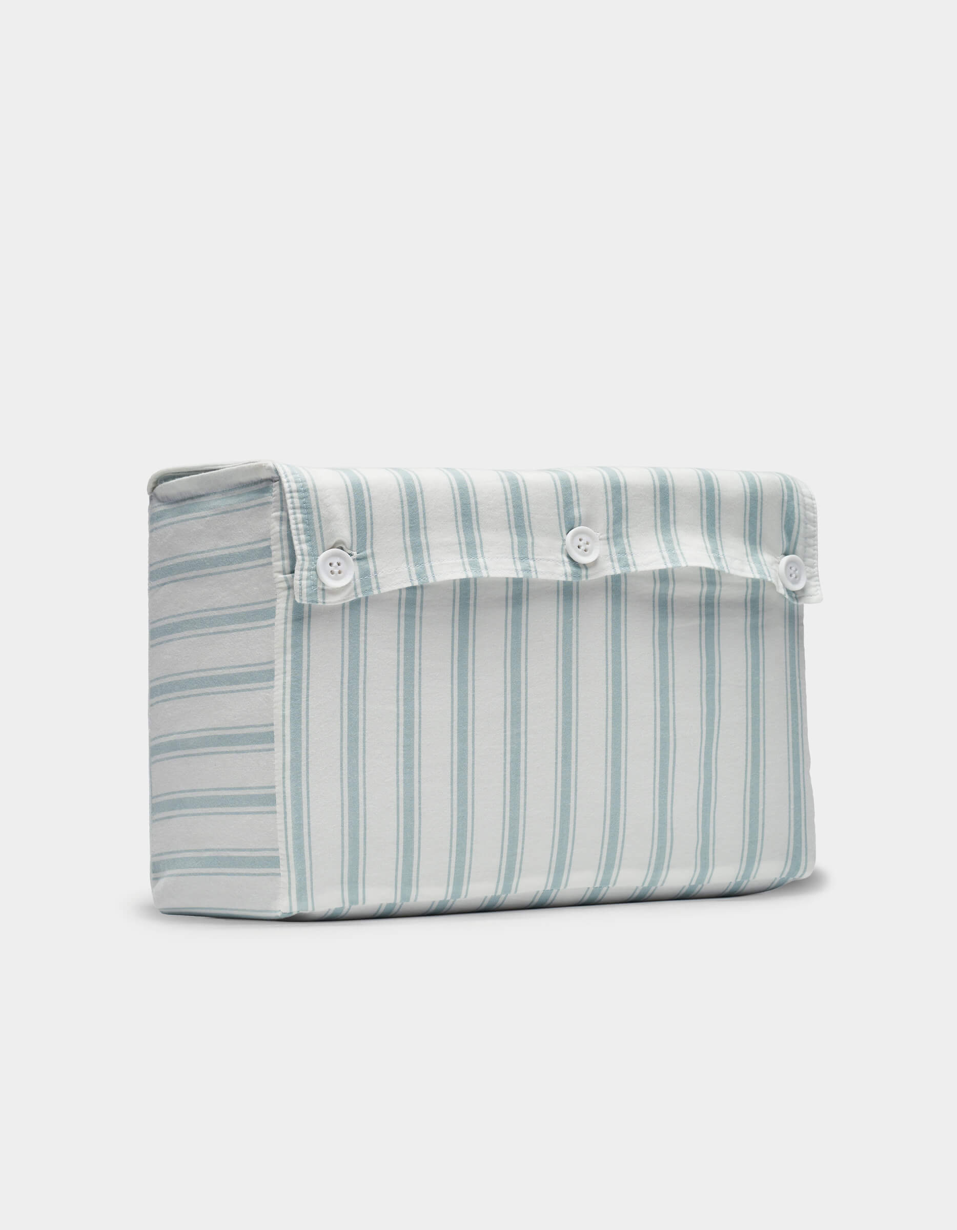 The Cozy Earth Soft-Wash Cotton Sheet Set features a rectangular pouch with light blue and white stripes and three white buttons on the top flap for closure.