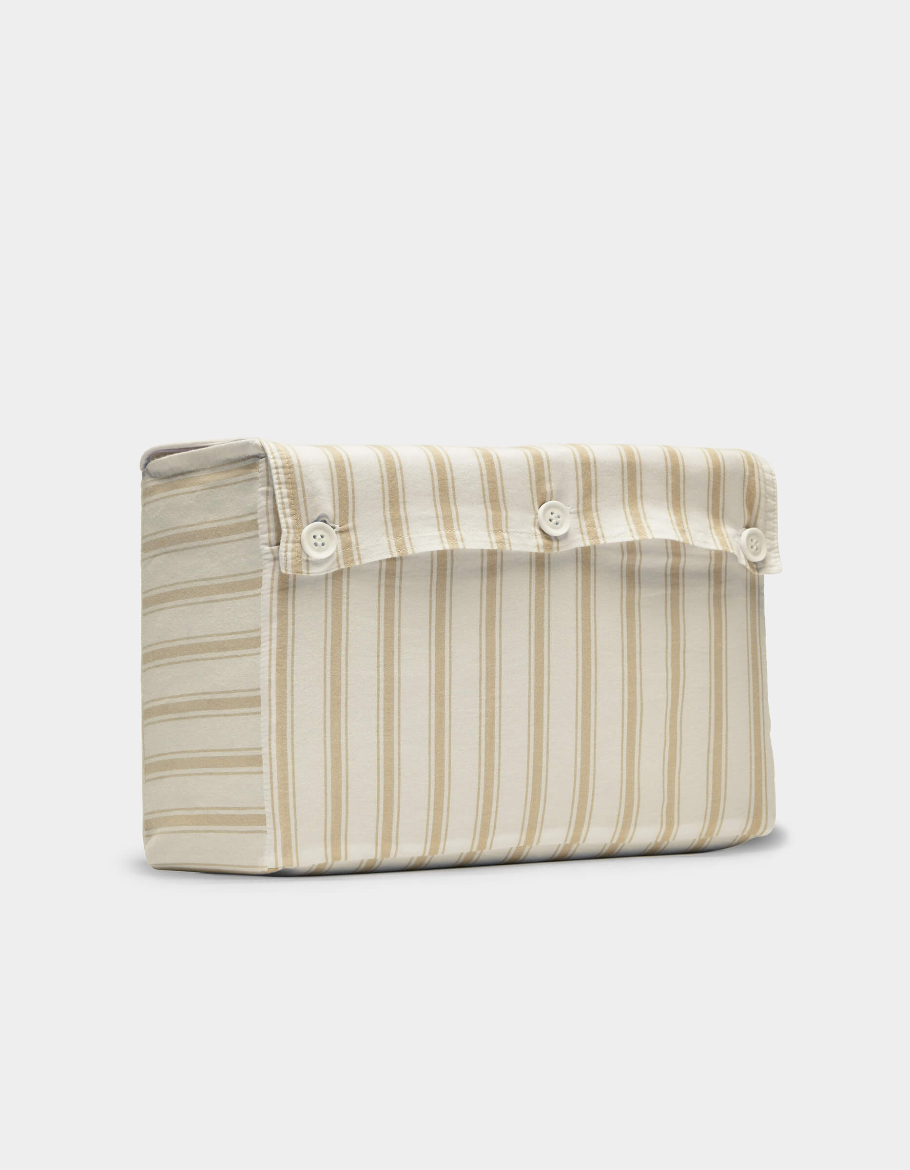The Cozy Earth Soft-Wash Cotton Sheet Set is displayed upright against a plain, light background, showcasing its beige and cream vertical stripes and flap closure with three white buttons.