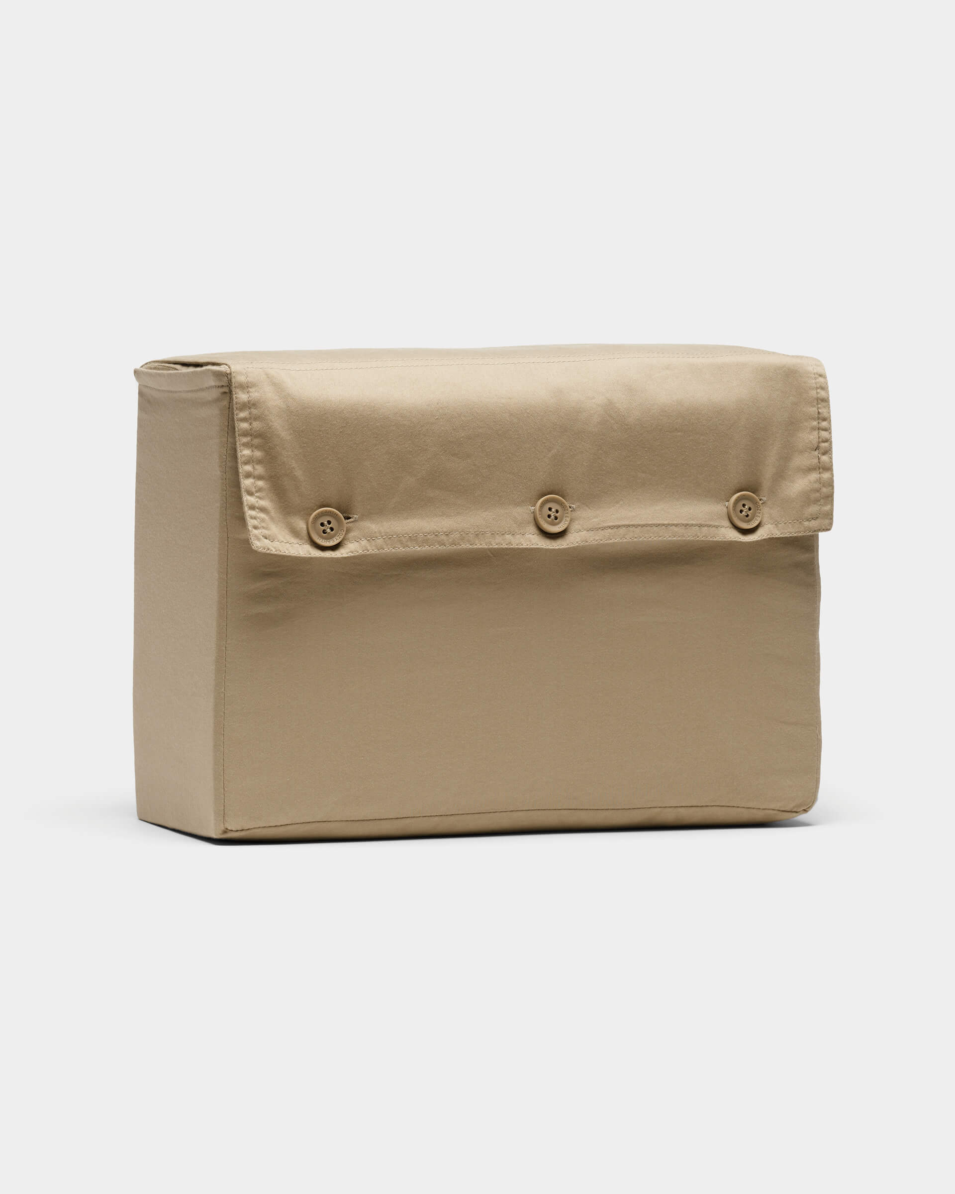 The Cozy Earth Soft-Wash Cotton Sheet Set, in beige, is neatly folded and displayed upright against a plain white background.