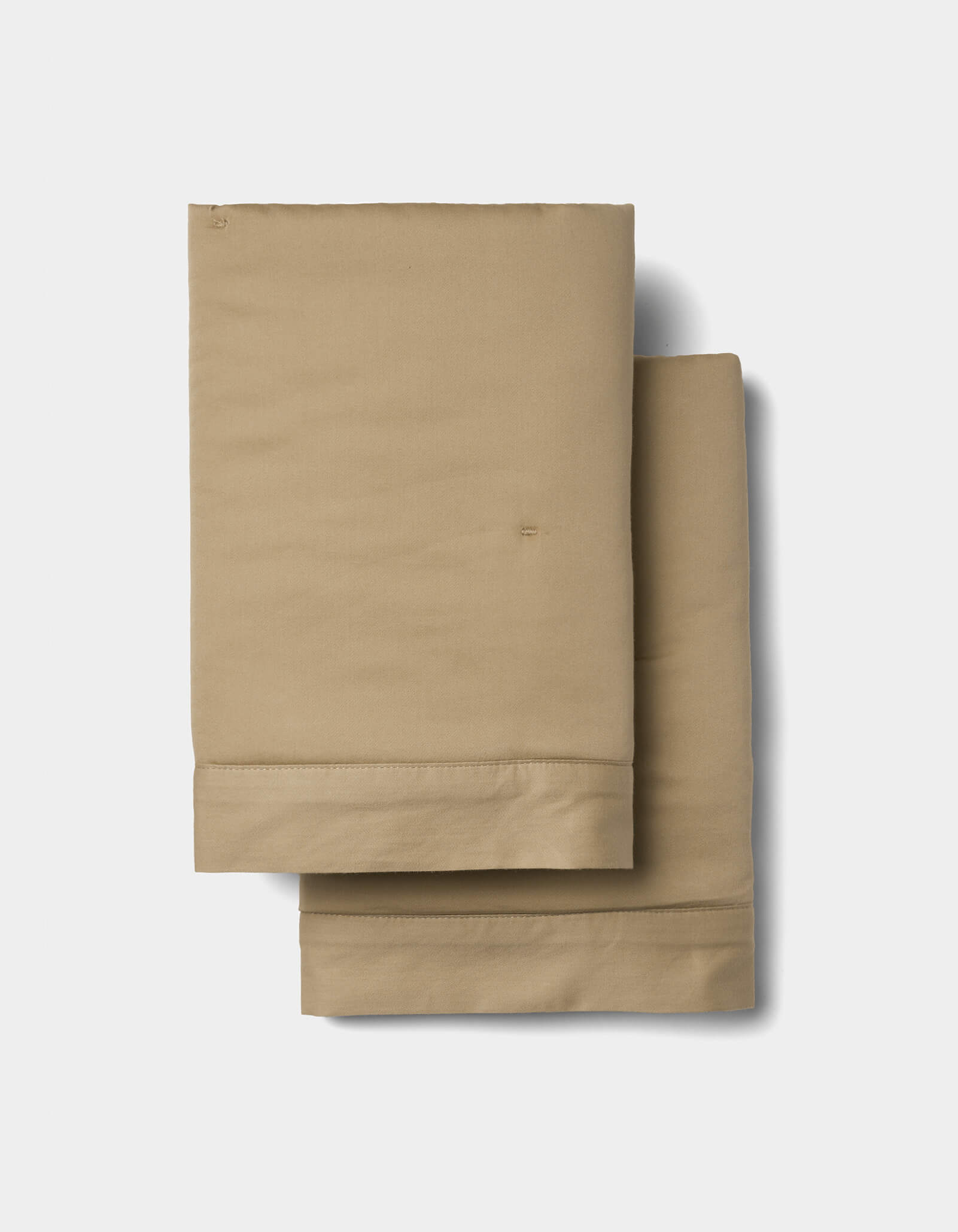 Two Soft-Wash Cotton Quilted Shams by Cozy Earth, neatly folded and stacked against a plain white background.