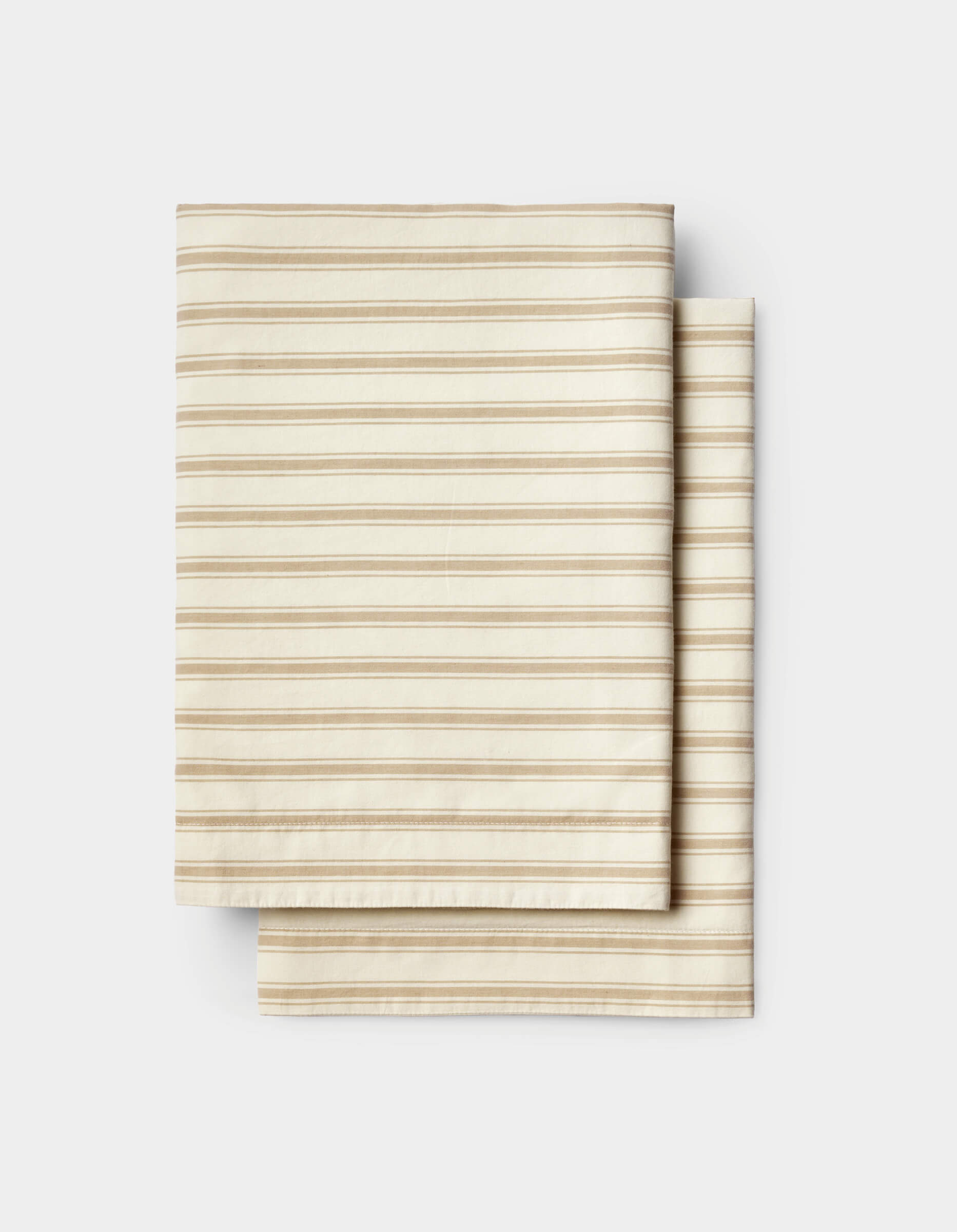 Cozy Earth Soft-Wash Cotton Shams in beige with thin brown horizontal stripes, neatly arranged on a white background.