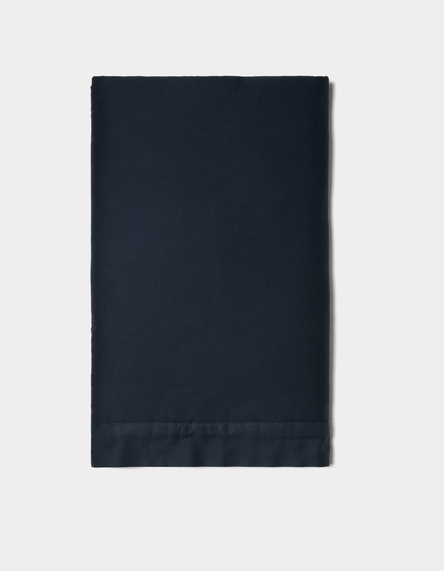 A neatly folded Soft-Wash Cotton Quilted Sham by Cozy Earth in solid dark navy blue is displayed on a plain white background.