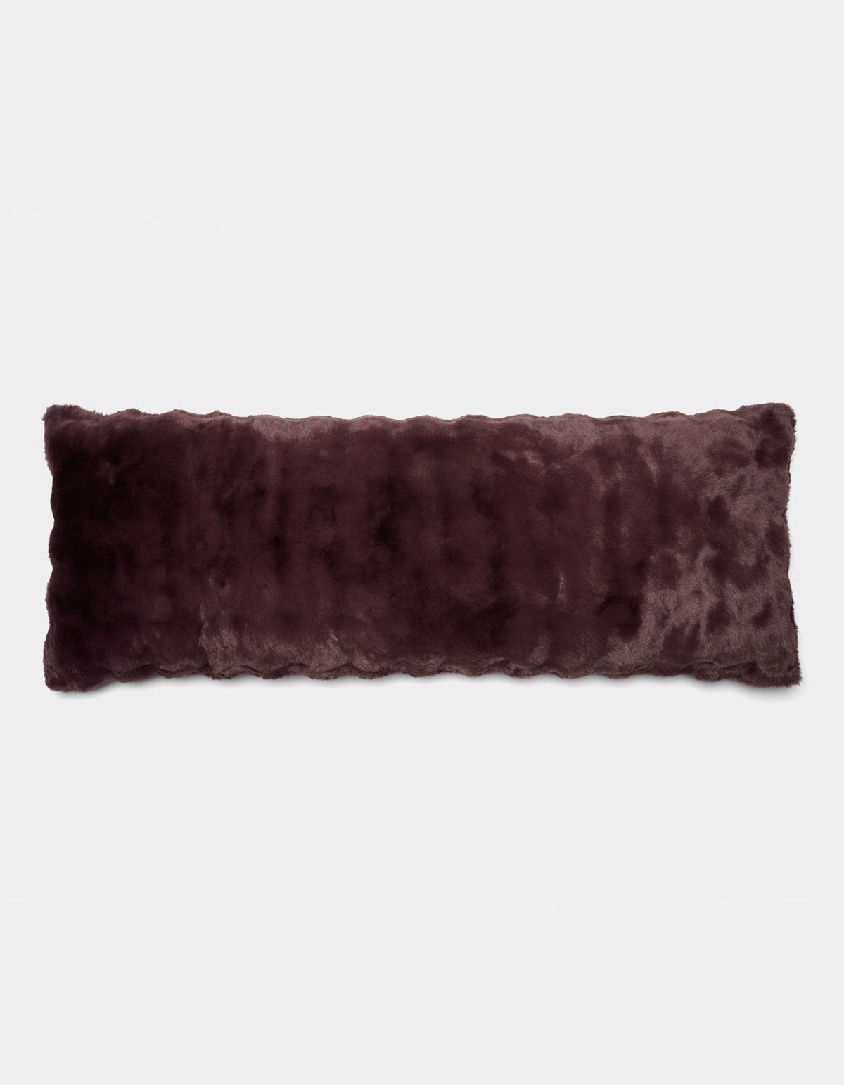 The Cozy Earth Bubble Cuddle Pillow, a long rectangular accent pillow in dark purple faux fur, is displayed against a plain white background.