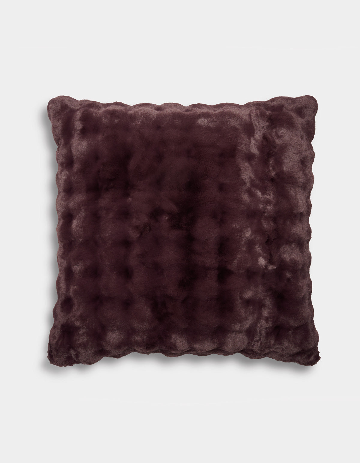 A square Bubble Cuddle Pillow by Cozy Earth, featuring dark purple faux fur with a soft, plush texture and slightly scalloped edges, displayed against a plain white background.