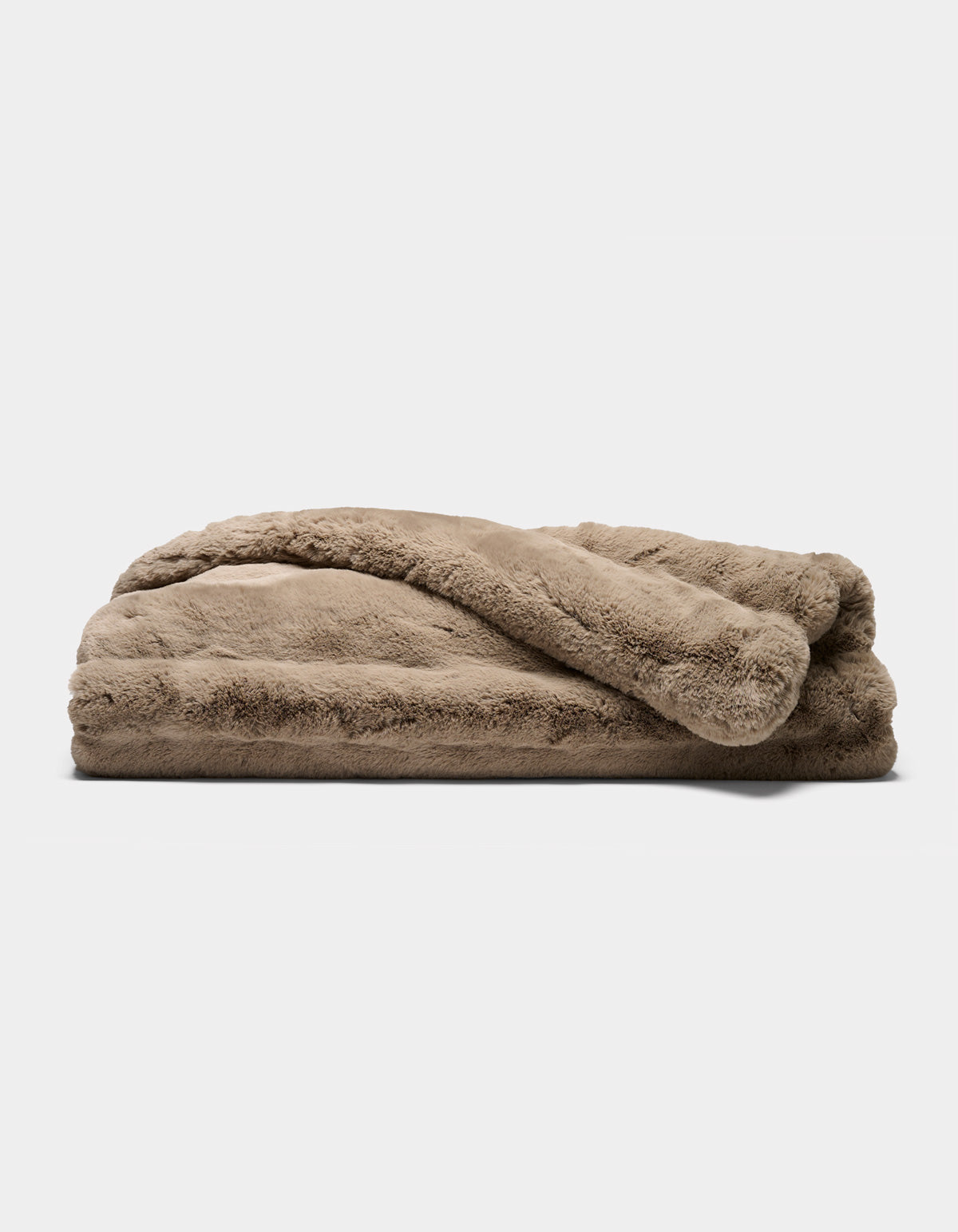 A folded Channel Cuddle Blanket by Cozy Earth, featuring a plush, light brown color and soft, fuzzy texture, resting on a plain white background.|Color:Walnut