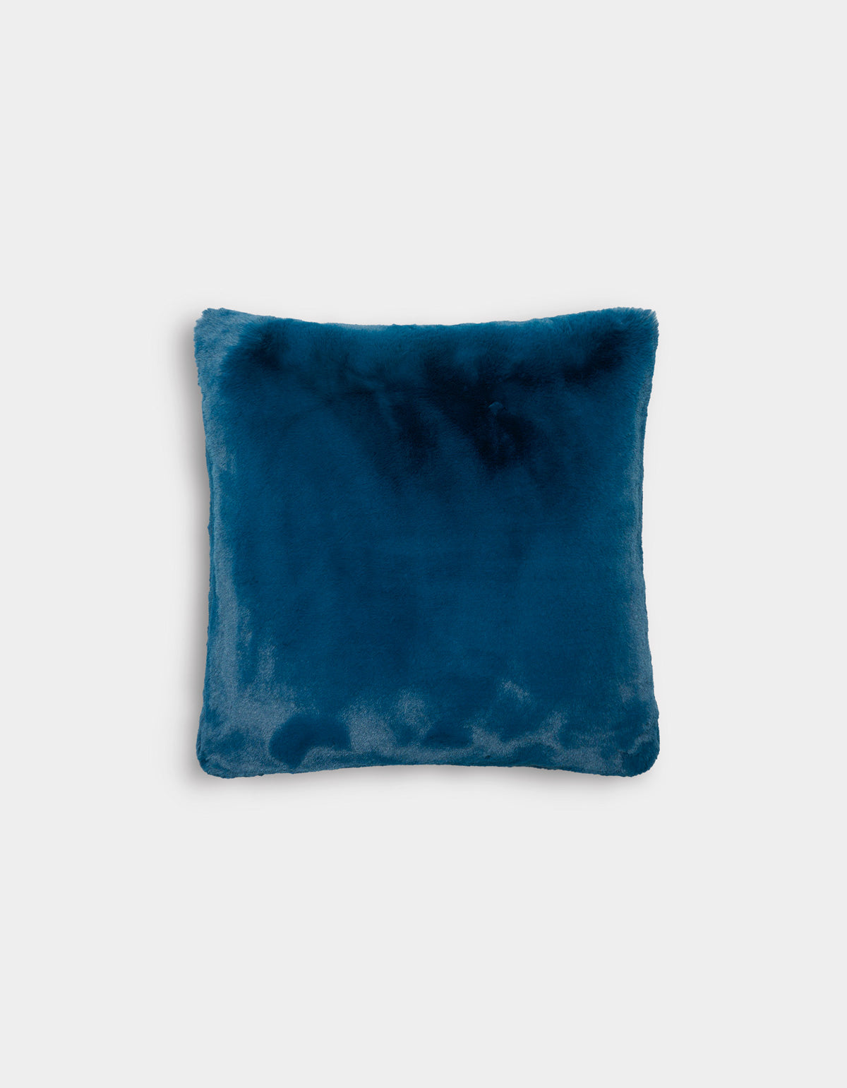 The Superplush Cuddle Pillow by Cozy Earth, featuring a square shape and soft, velvety texture in a plush teal blue, is displayed against a plain white background.