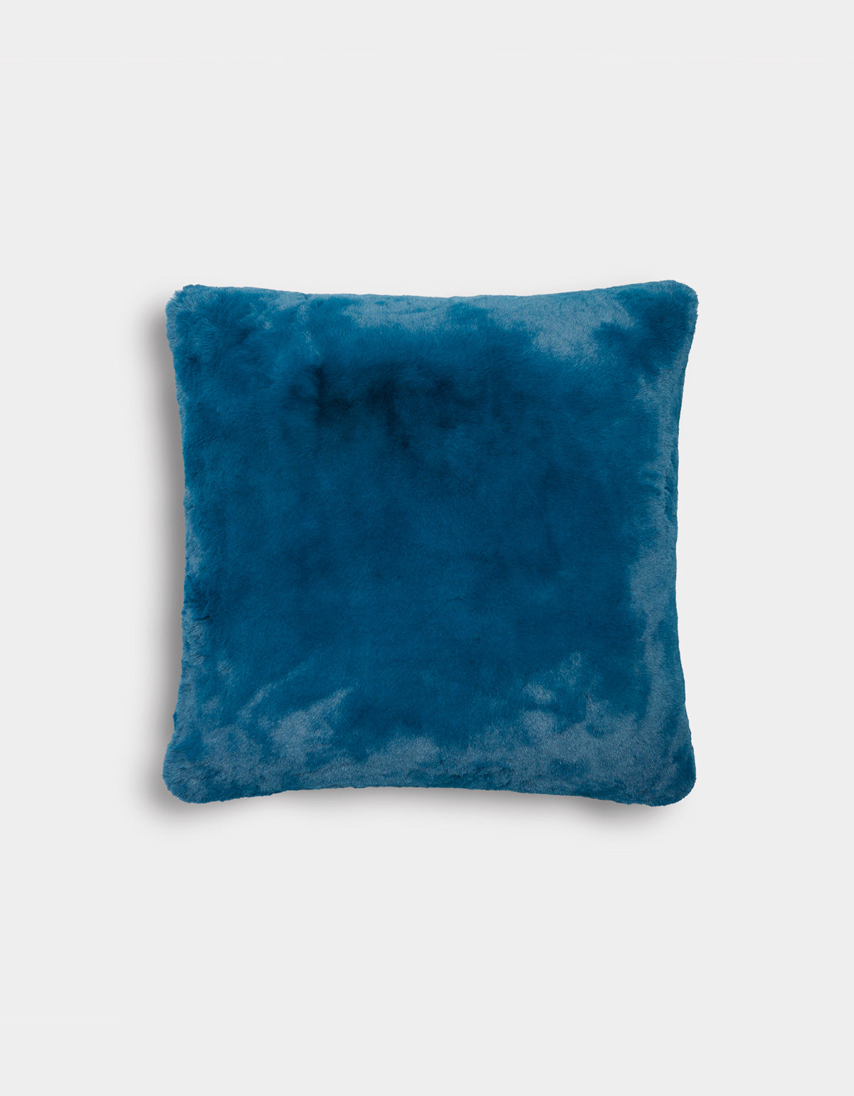 The Superplush Cuddle Pillow by Cozy Earth, featuring a square shape and soft, plush blue texture, is displayed against a plain white background.