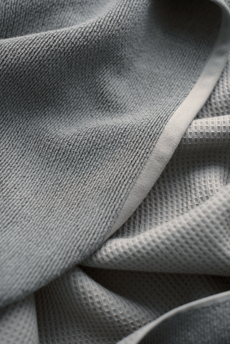 Waffle Bath Towel in the color Charcoal. Photo of Charcoal Waffle Bath Towel taken close up showing only the Charcoal.