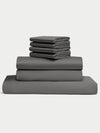 Set of gray bedding including sheet, a duvet cover and pillowcases on a white background. |Color:Charcoal
