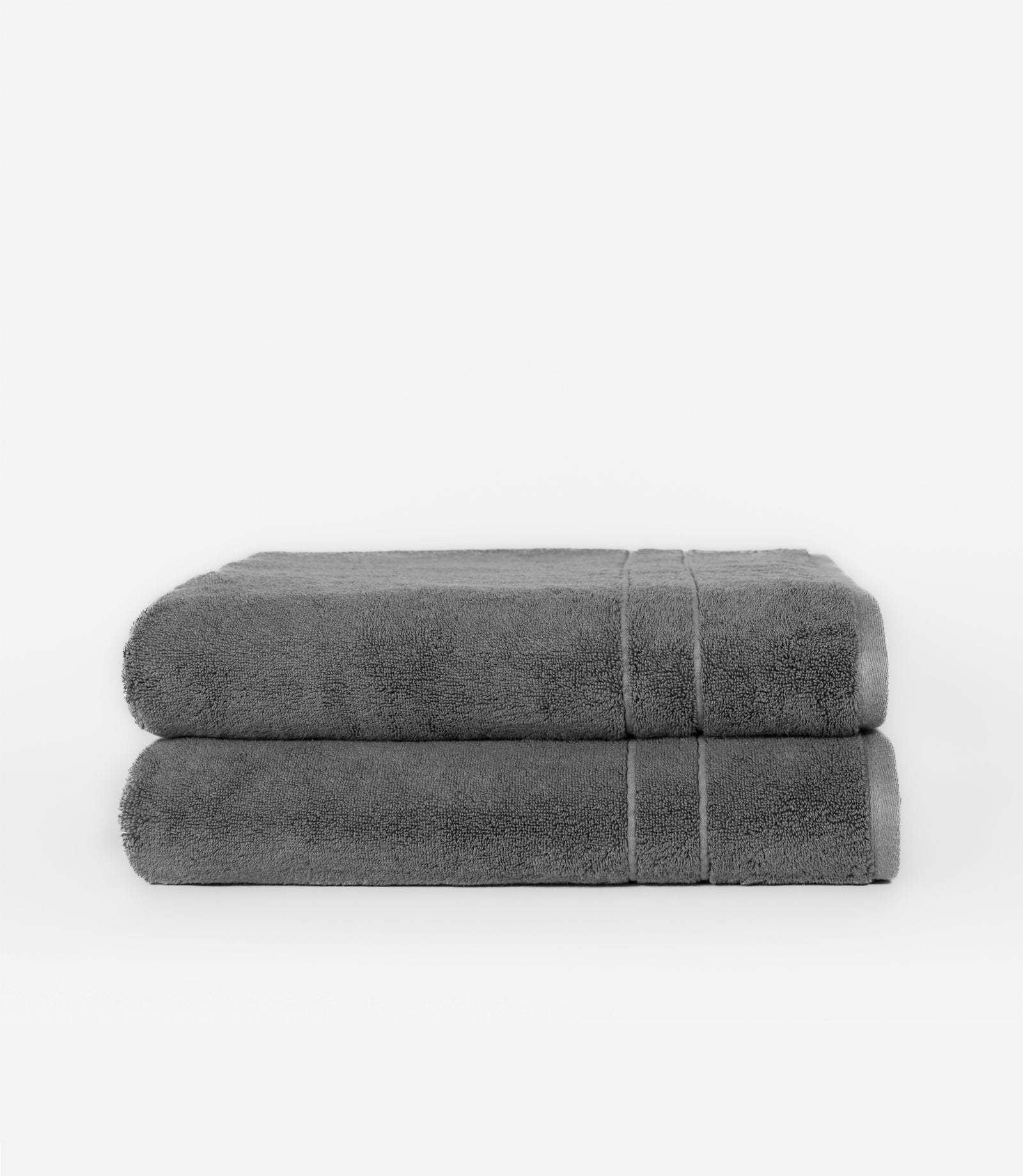 Premium Plush Bath Sheets in the color charcoal. Photo of bath sheets taken with white background 