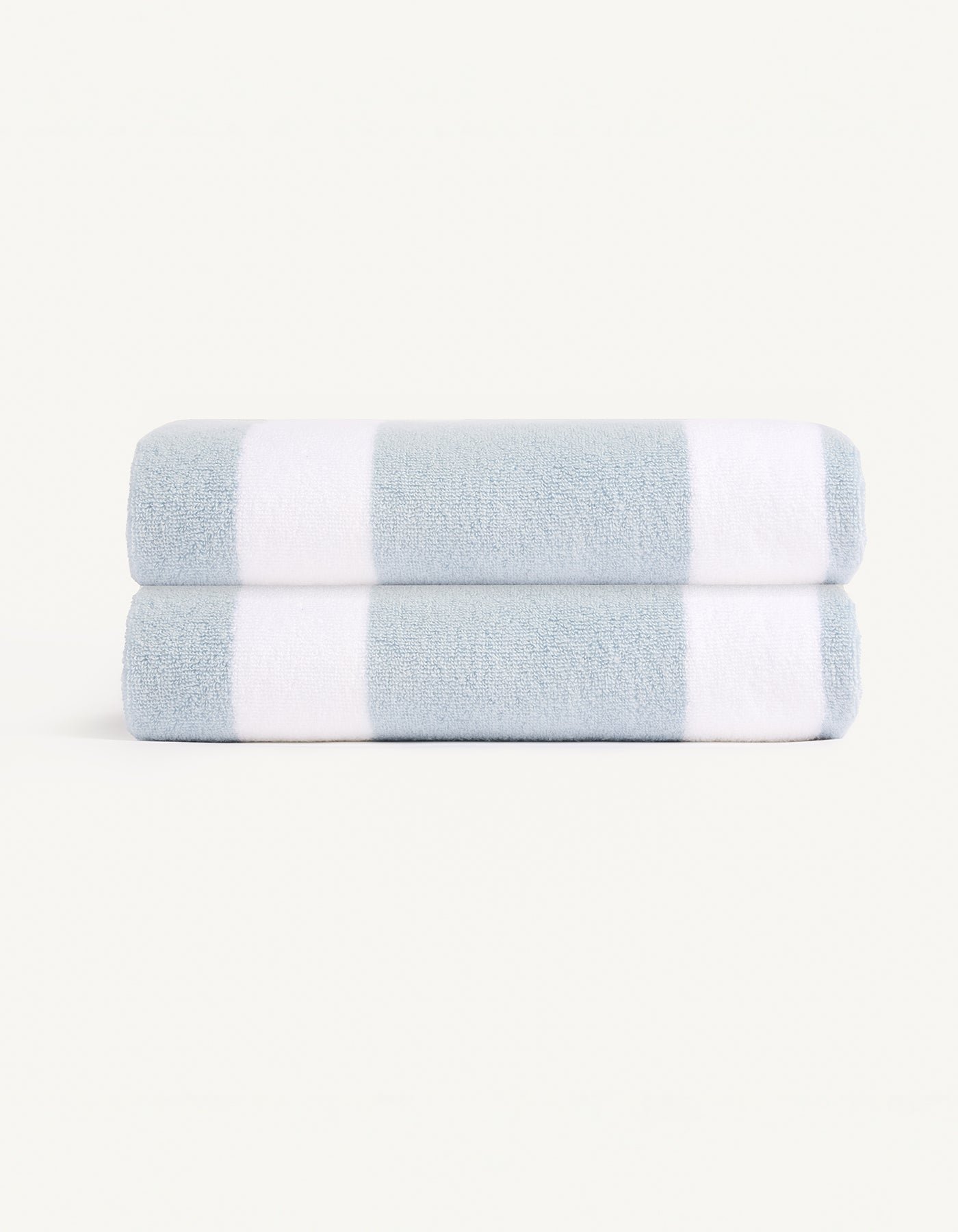 The Cozy Earth Classic Stripe Resort Towel Bundle features neatly folded towels with wide blue and white stripes, set against a plain, light background. |Color:Breeze