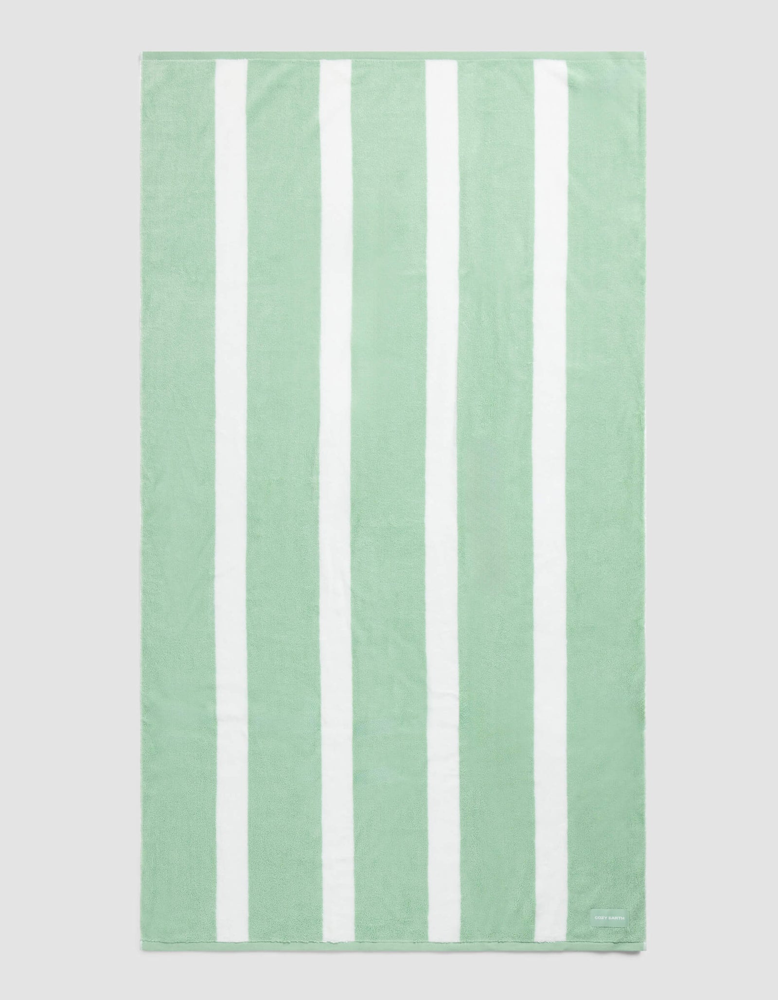 The Cozy Earth Classic Stripe Resort Towel in Julep features wide, evenly spaced light green and white vertical stripes and is displayed laid flat against a plain background.