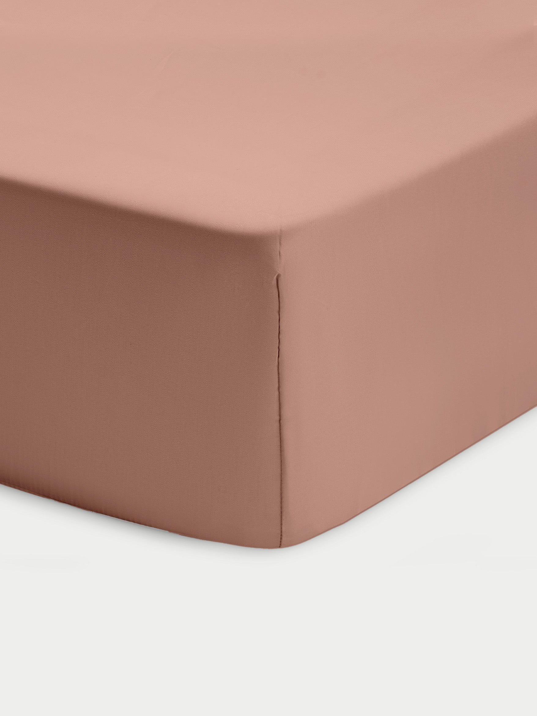 Corner of clay crib sheet with white background 