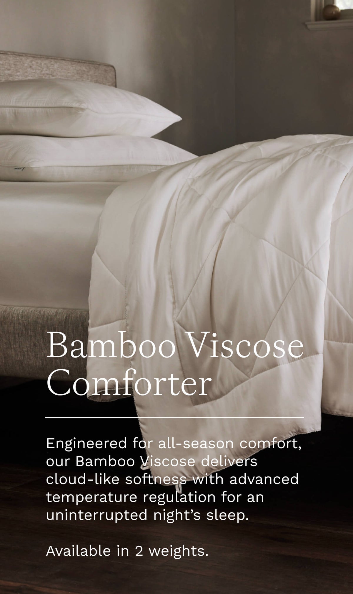 a bed with white comforter and two pillows