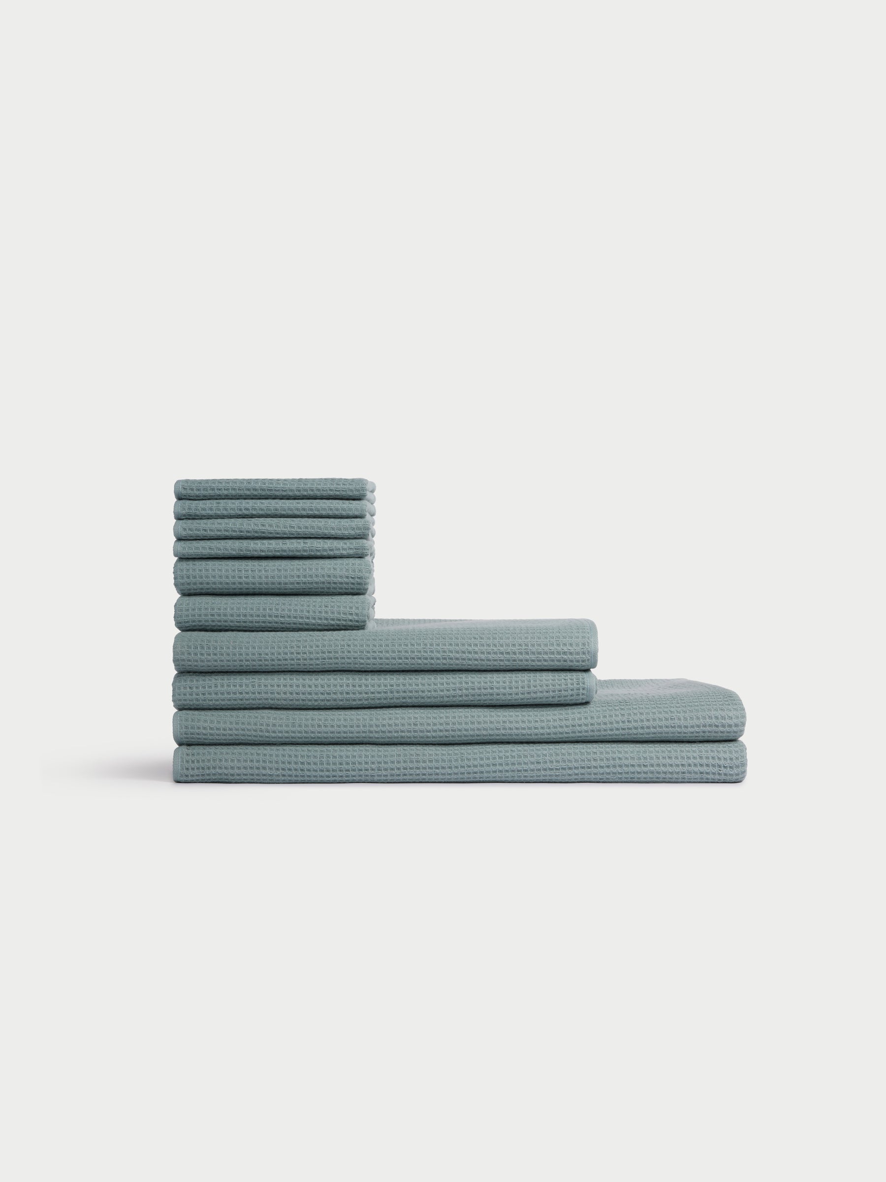 The Cozy Earth Complete Waffle Bath Bundle is neatly stacked and arranged against a plain white background. |Color:Brook