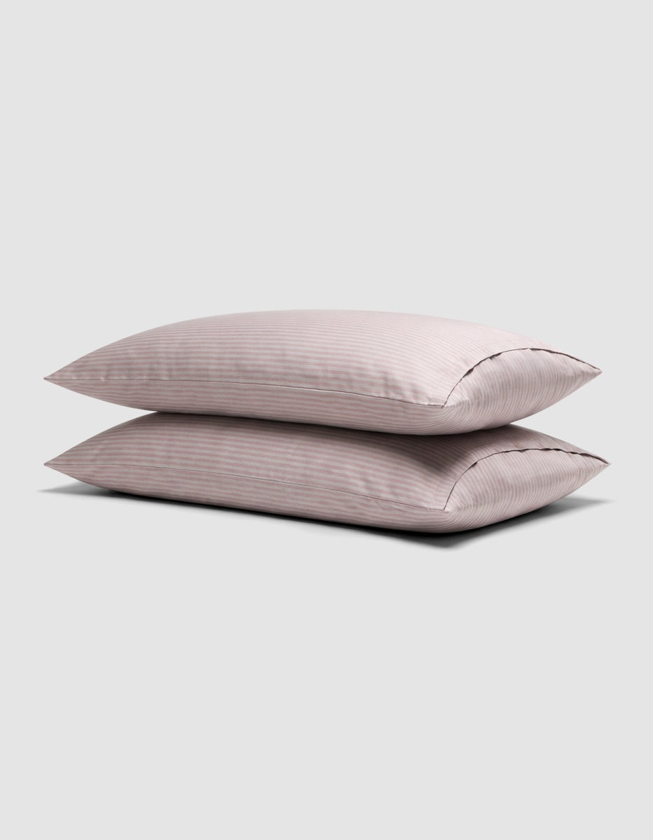 Two stacked Bamboo Pillowcases featuring a lavender stripe patter