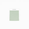 A laurel-colored Bamboo Sheet Swatch with zigzag edges is attached to a white card labeled "Cozy Earth," set against a plain white background.