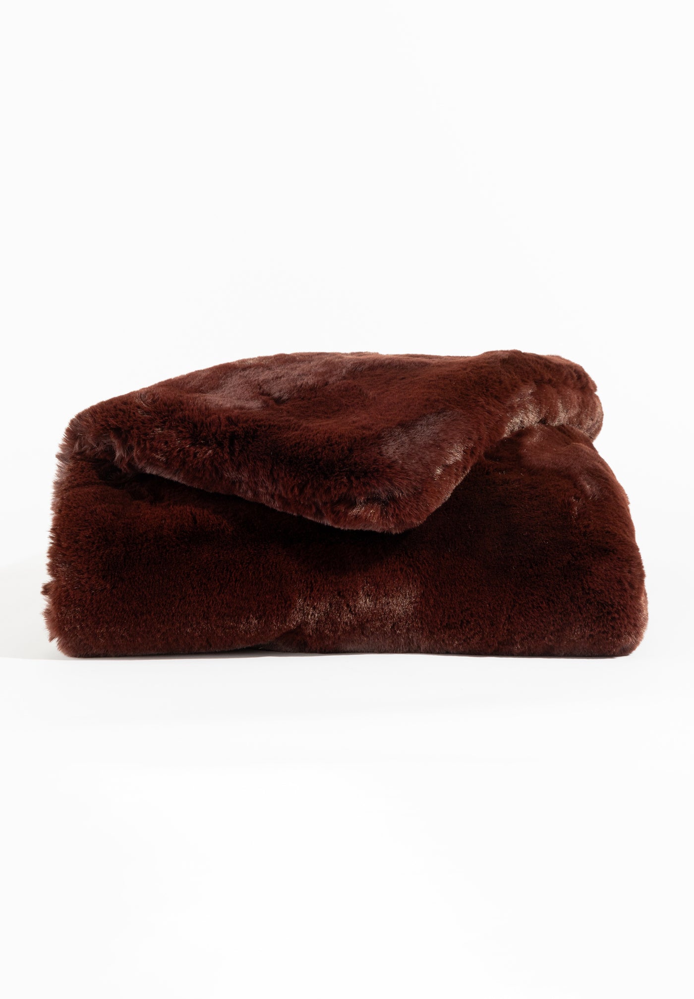 The Cuddle Blanket by Cozy Earth is displayed on a white background, featuring its soft texture and plush brown fleece. |Color:Burgundy