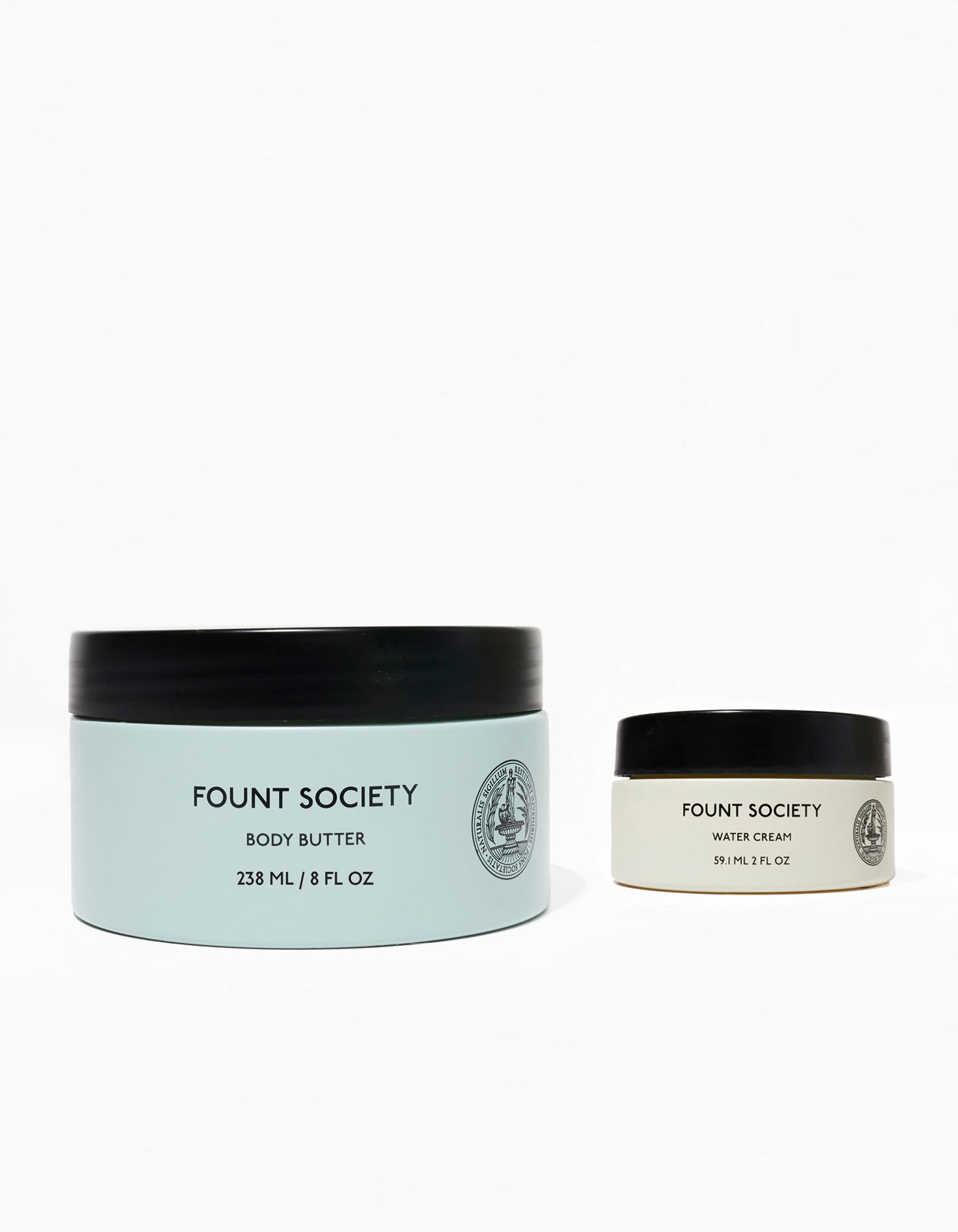 Two containers of Fount Society Body Butter and Water Cream on a white background