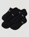 Four pairs of black Women's Essential Ankle Socks by Cozy Earth, featuring a textured pattern and partial white text near the cuffs, displayed on a light gray background.|Color:Black